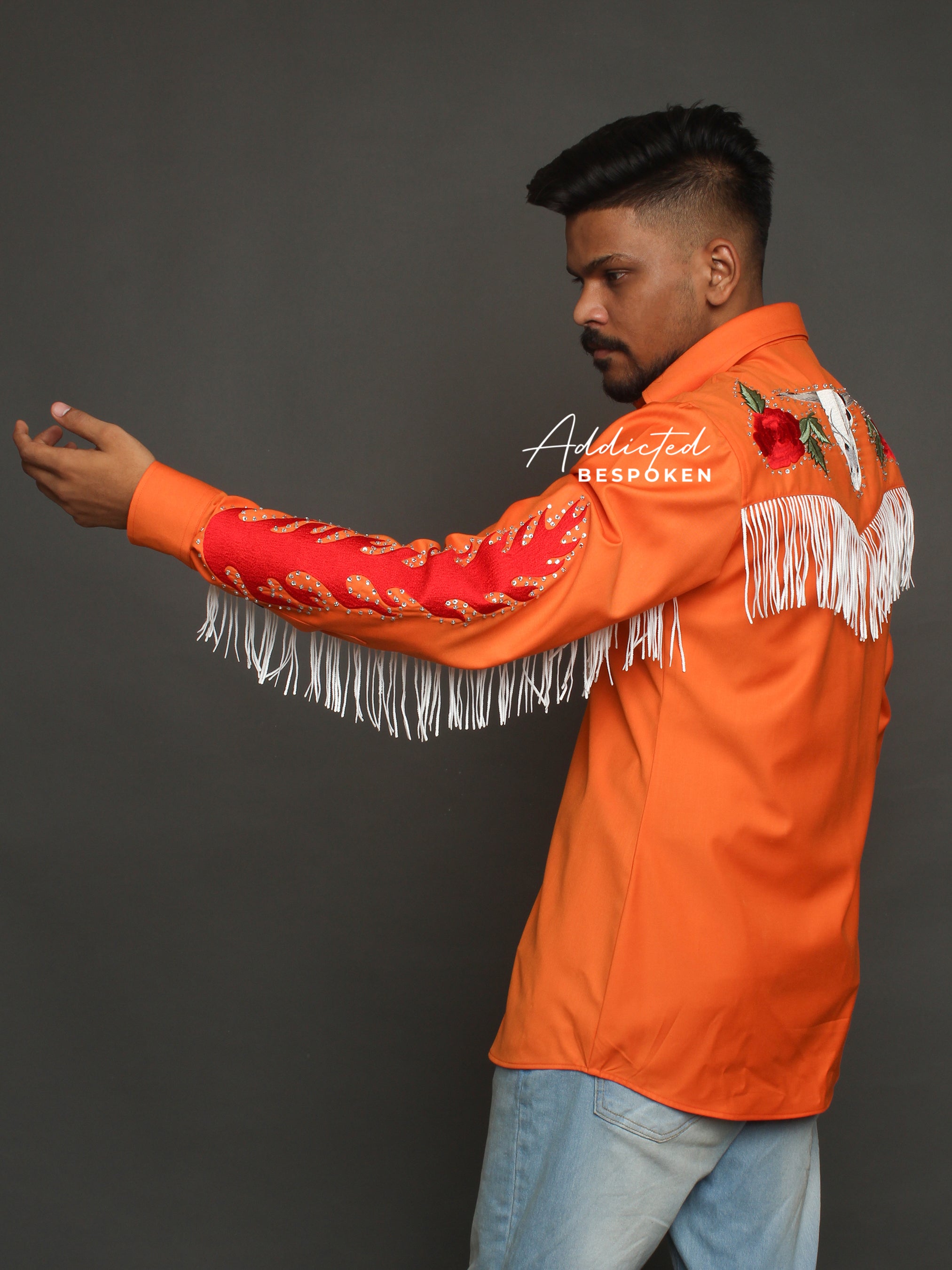 Male model in orange embroidered western shirt with fringe and blue jeans โ Addicted Bespoken