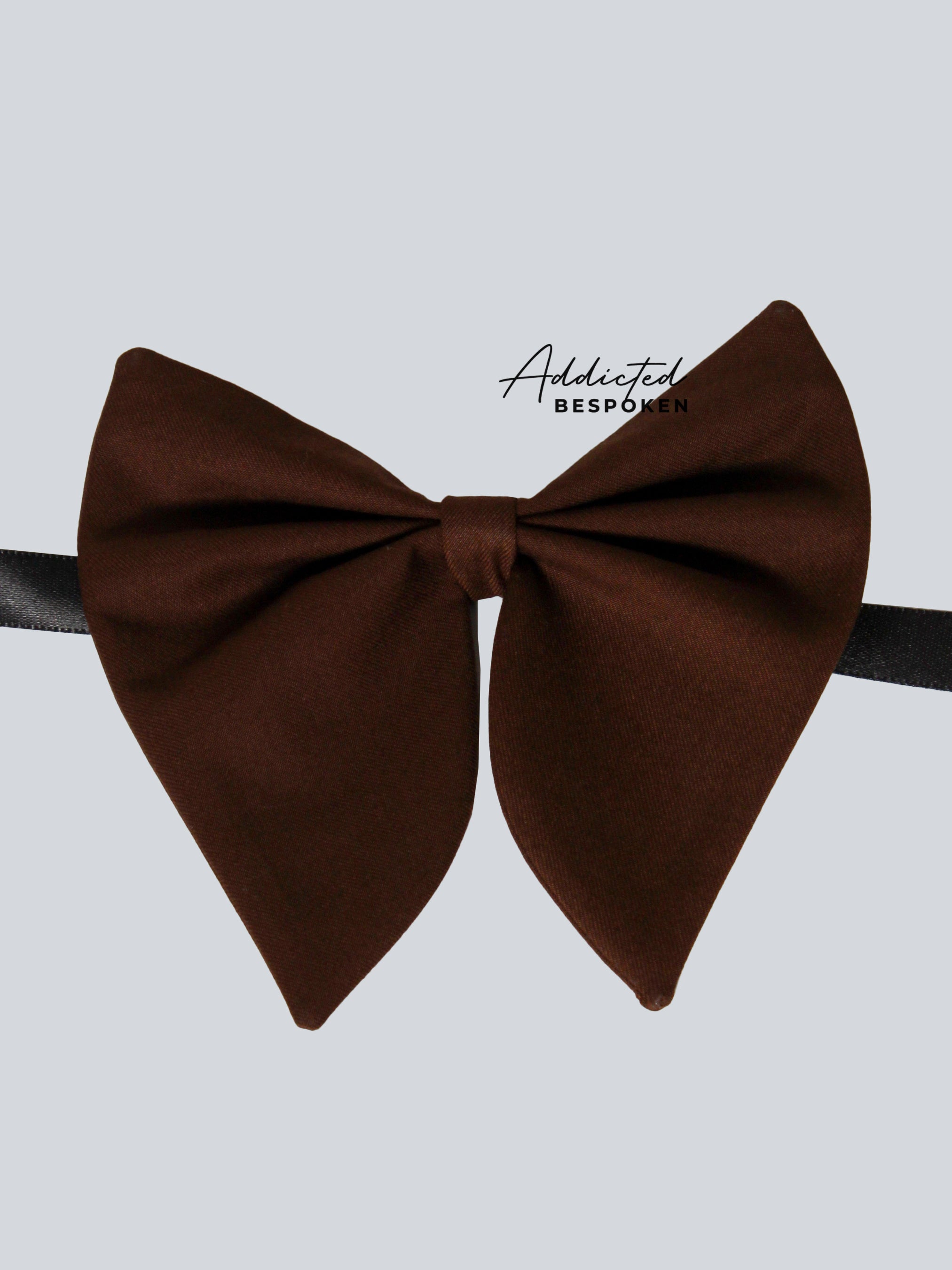 Brown western bow tie accessory displayed on plain background – Addicted Bespoken