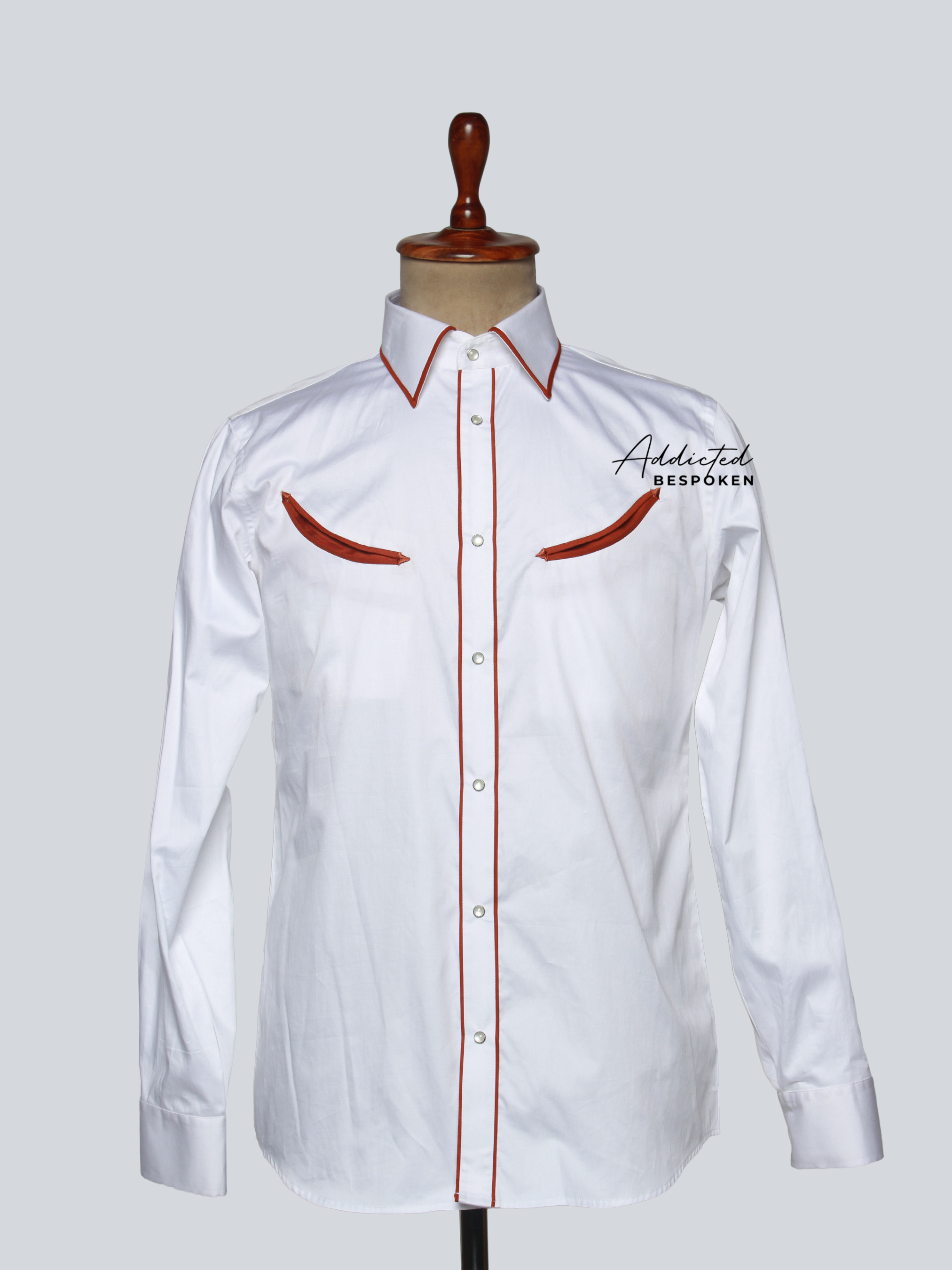 Front view of white western shirt with red piping and subtle embroidery – Addicted Bespoken