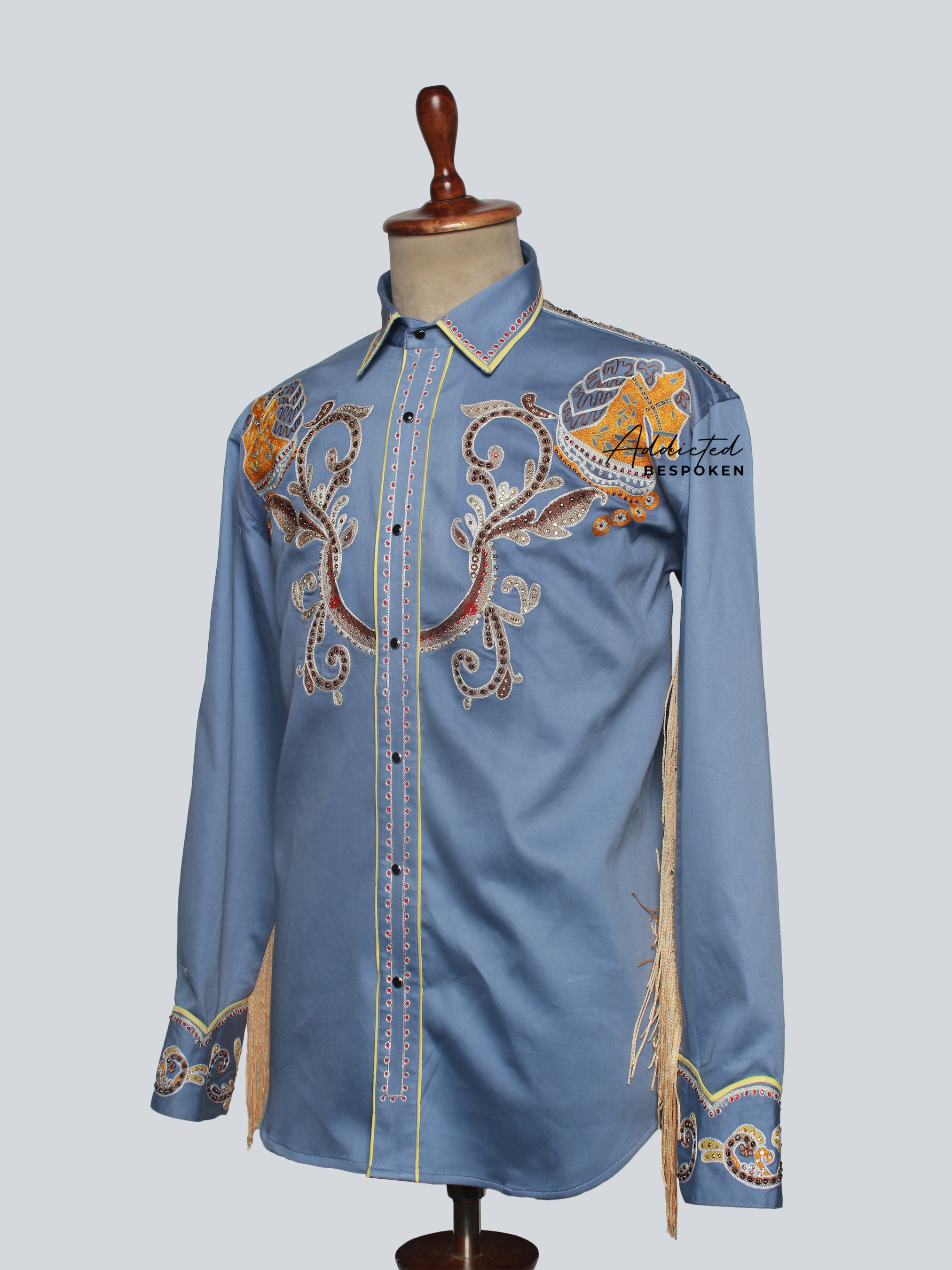 Angled view of light blue embroidered western shirt with golden floral patterns β Addicted Bespoken