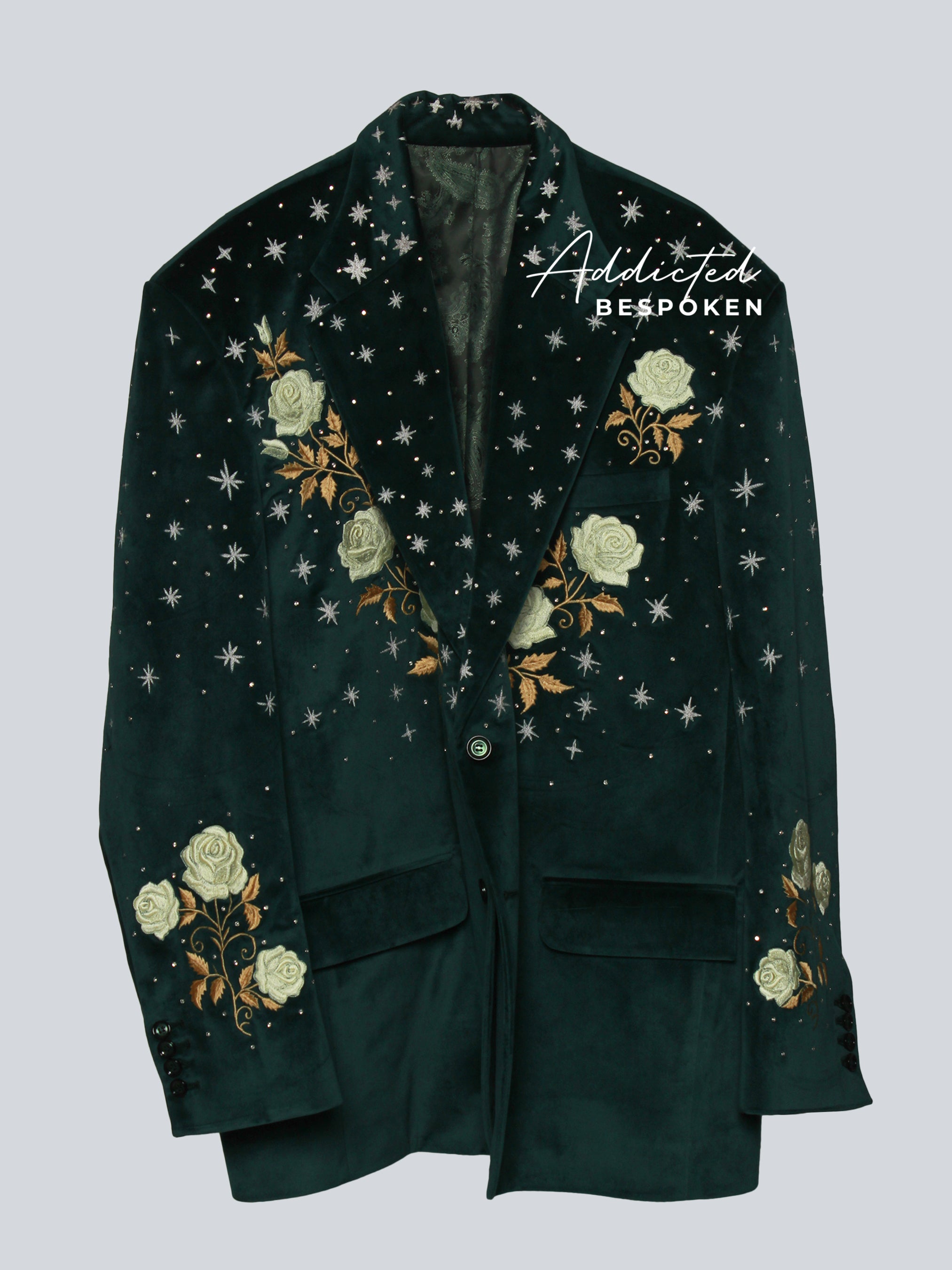 Dark green embroidered blazer with golden floral and celestial star designs – front view