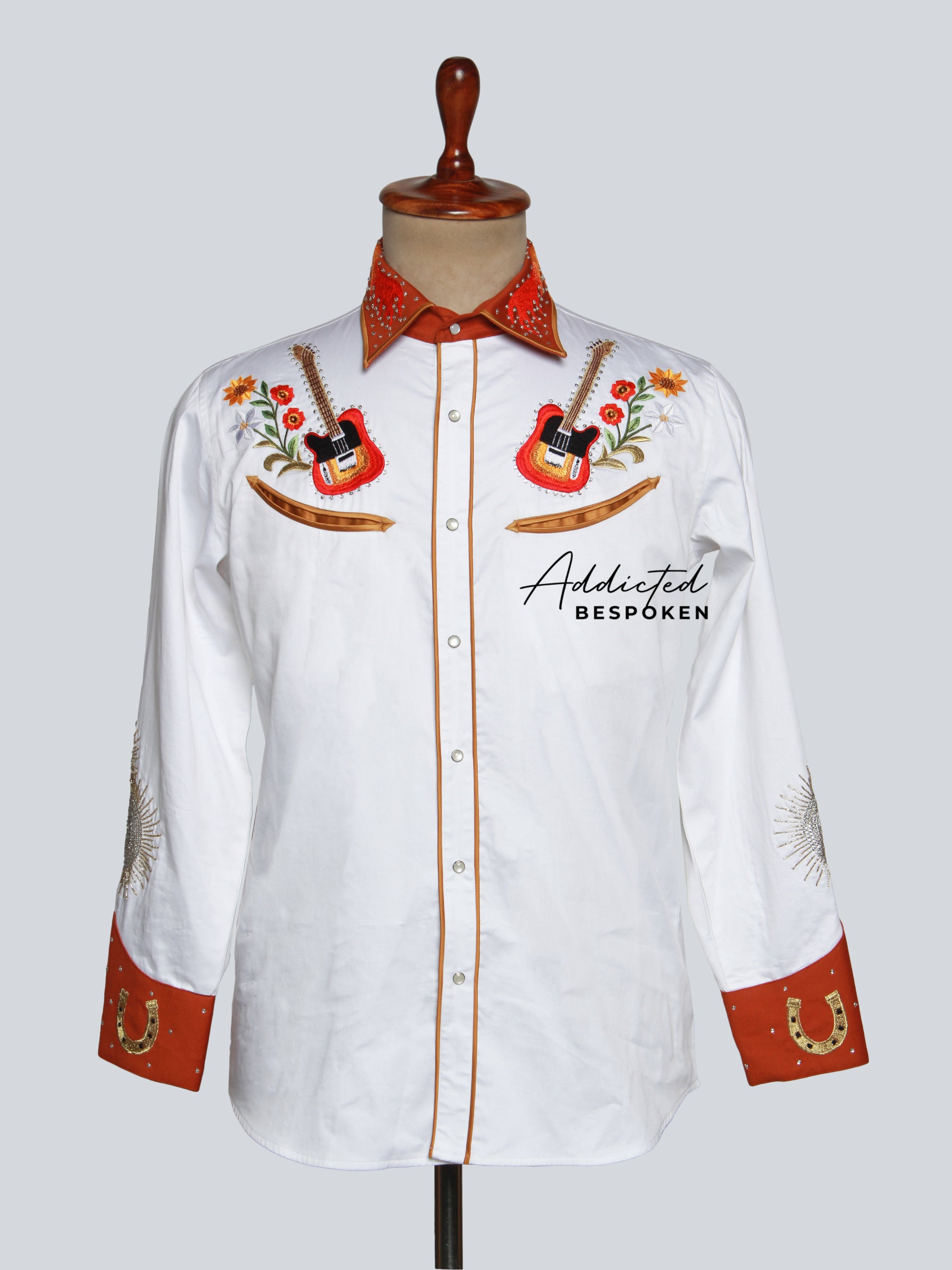 Front view of white western shirt with orange floral embroidery and contrast cuffs – Addicted Bespoken