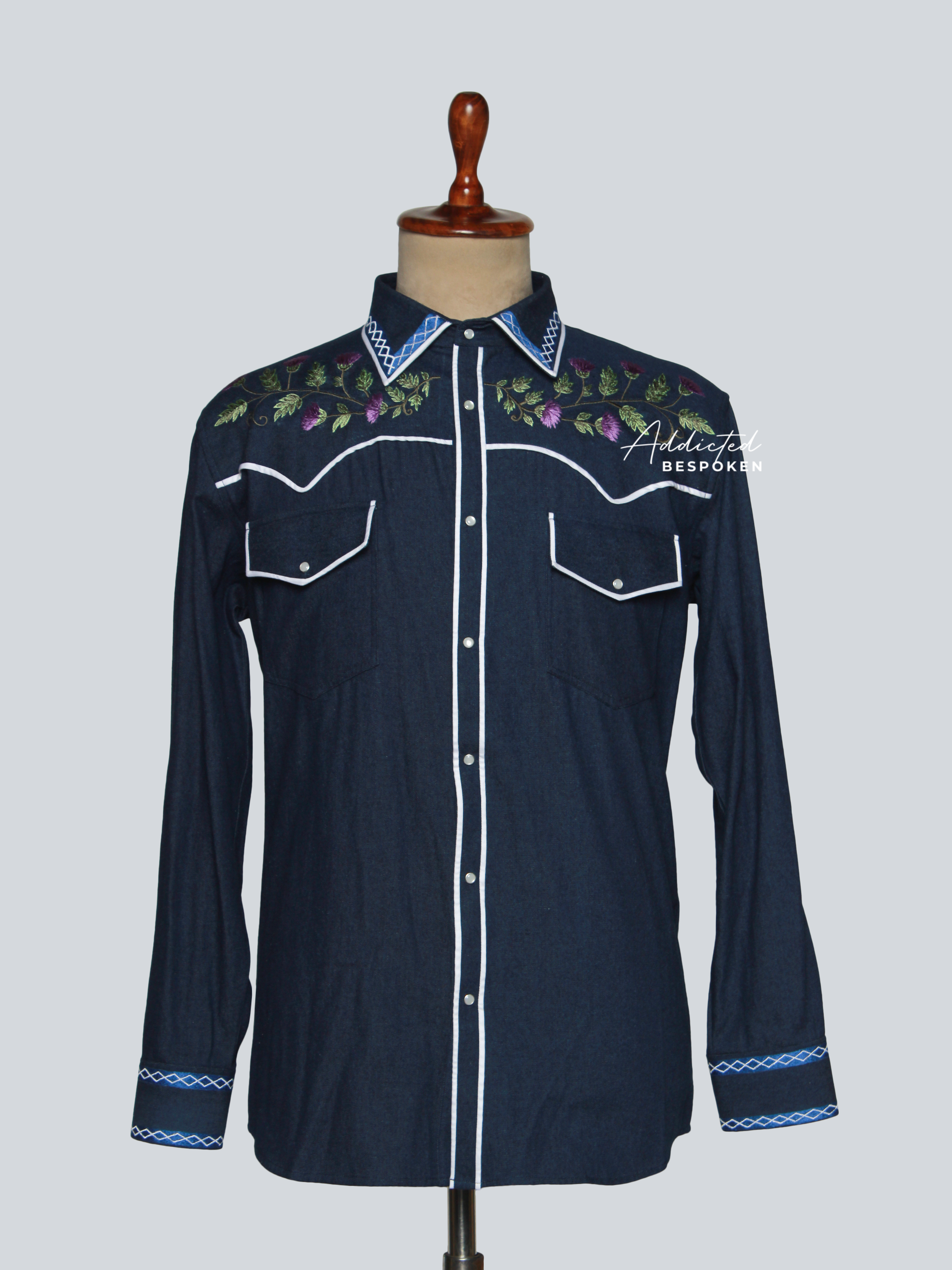 Front view of dark denim western shirt with floral embroidery and white piping – Addicted Bespoken