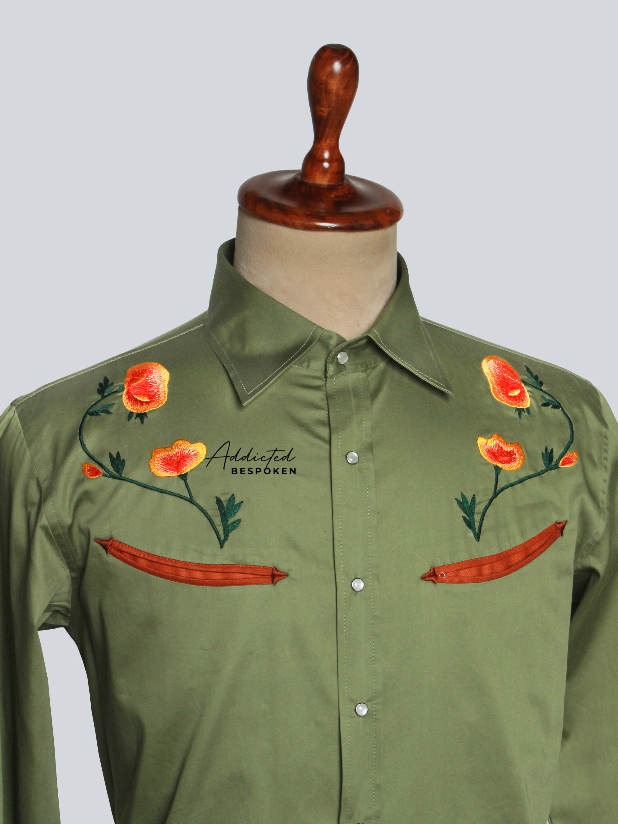 Close-up of embroidered floral details on olive green western shirt – Addicted Bespoken