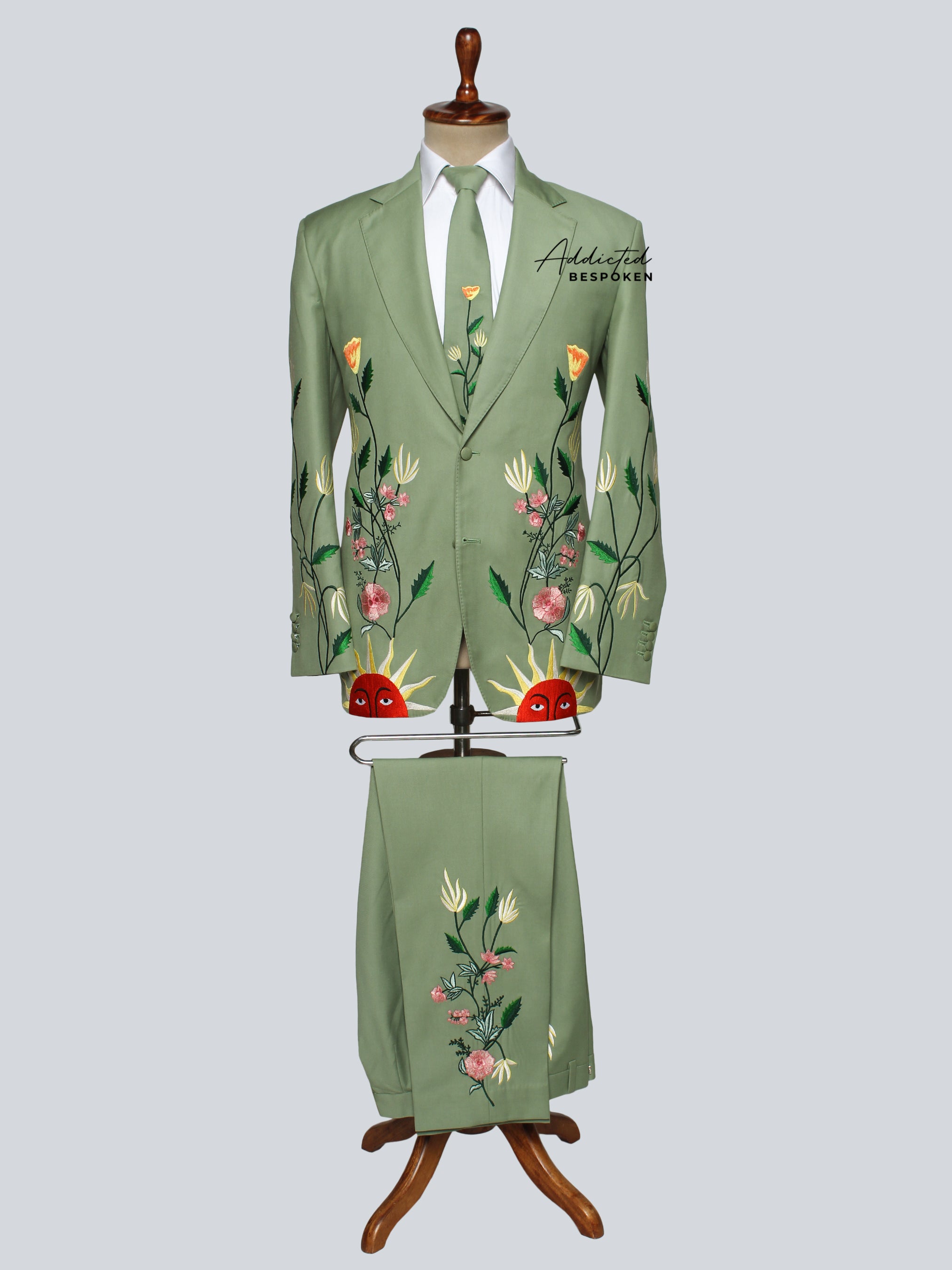 Full Sun Bloom Western Suit front view – green embroidered jacket, pants, vest, and tie for men