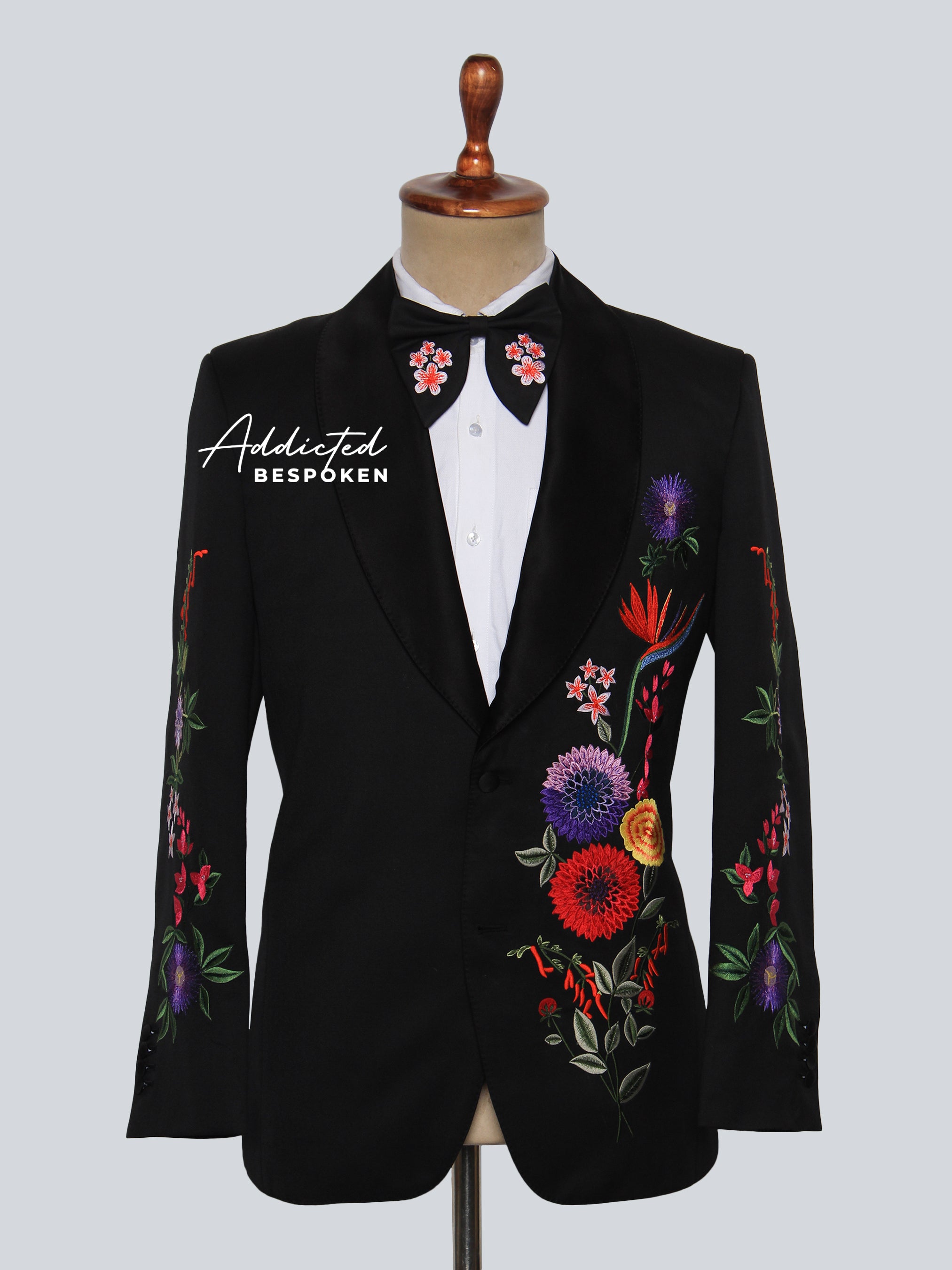 Black embroidered blazer with colorful floral patterns – front view on mannequin