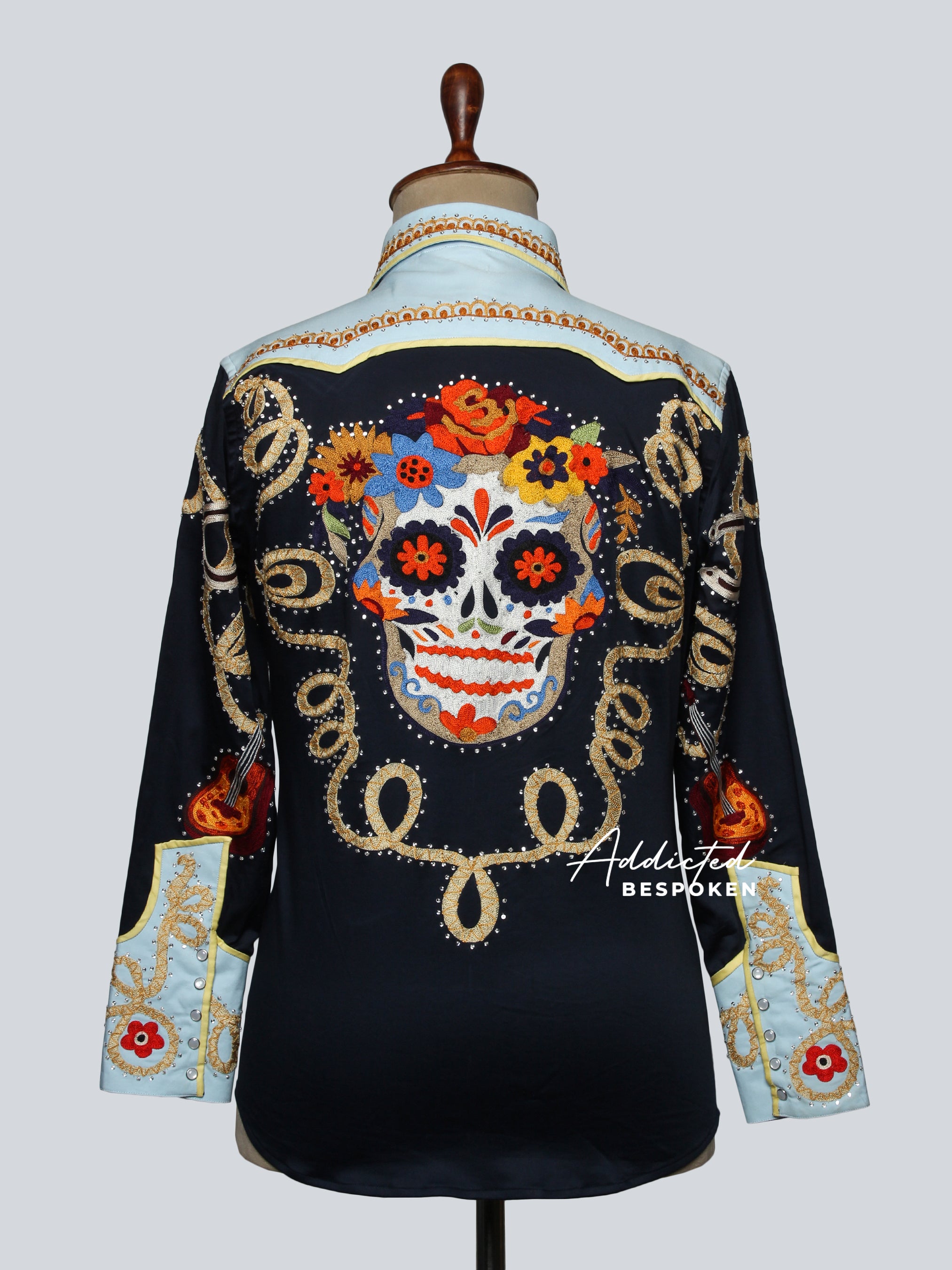 Back view of black and cream western shirt with golden embroidery displayed on mannequin – Addicted Bespoken
