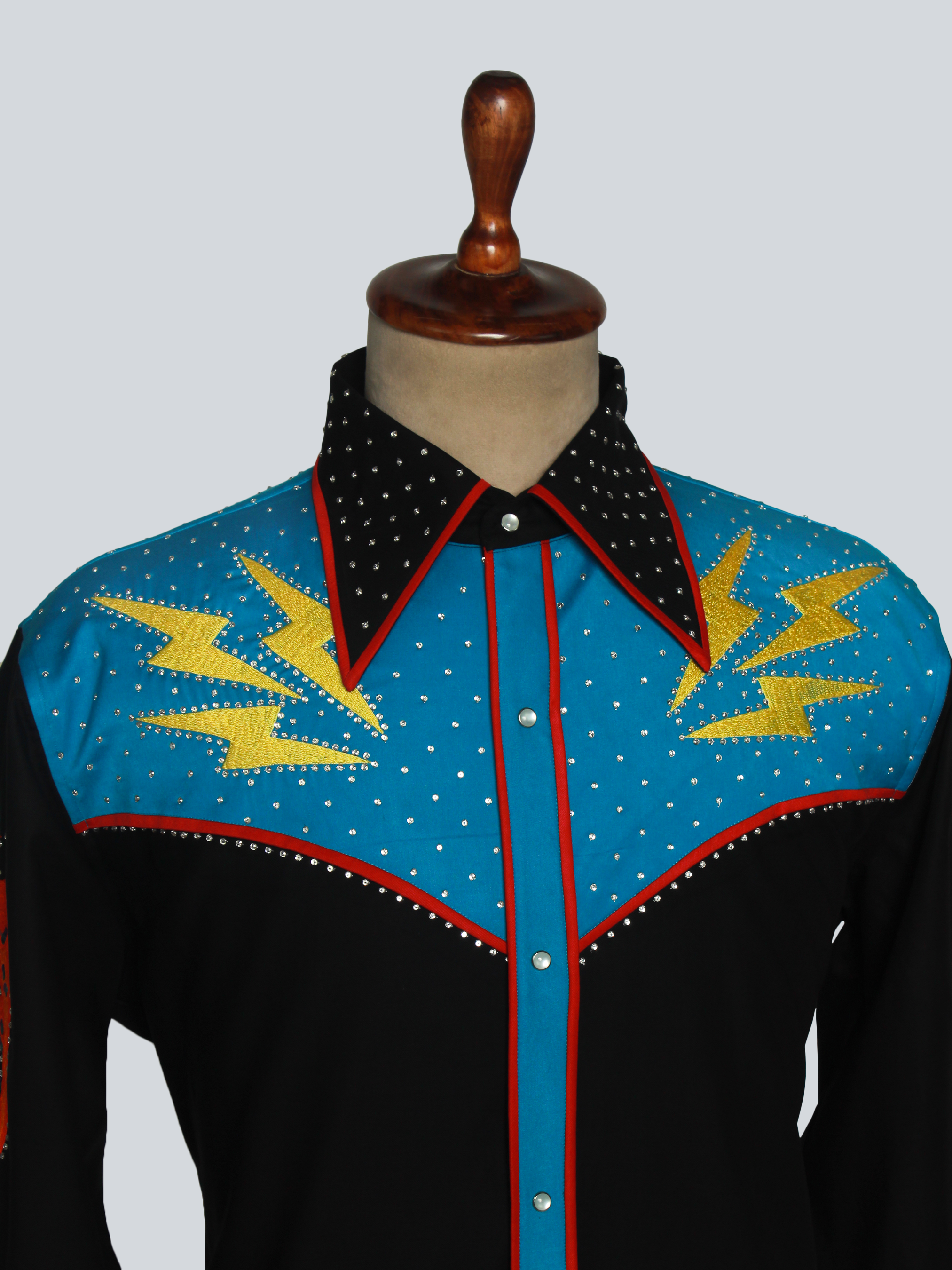 Close-up chest view of embroidery on black western shirt with blue accents – Addicted Bespoken
