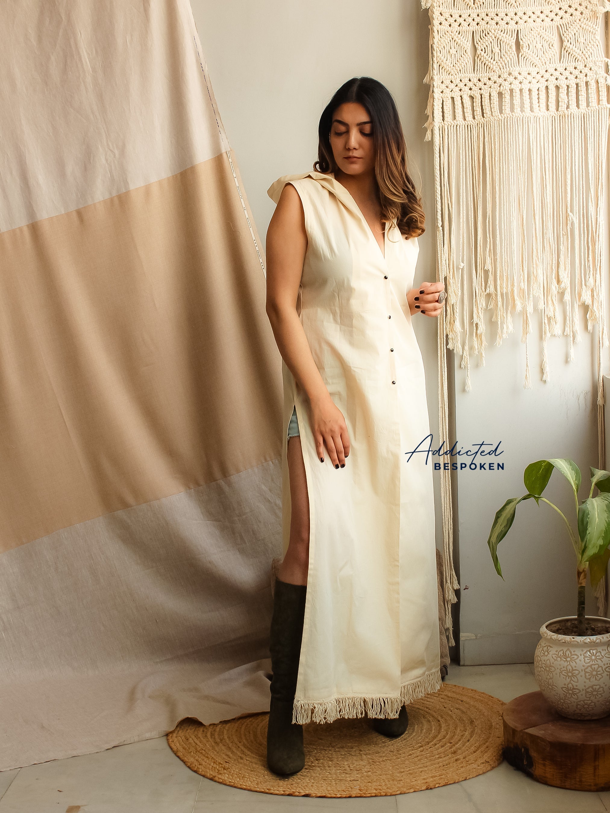 Woman wearing Ethereal Hooded Maxi Dress with fringe hem – bohemian style clothing