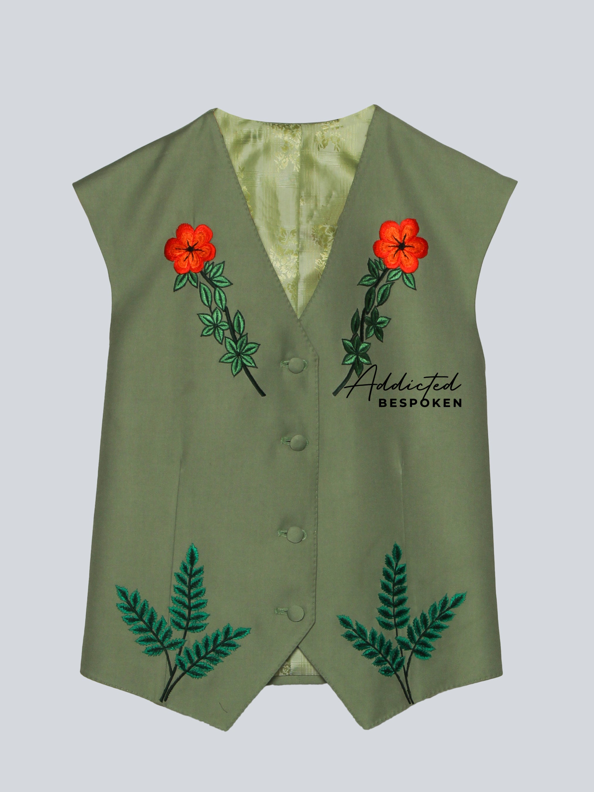 Green vest with floral embroidery on a light gray background