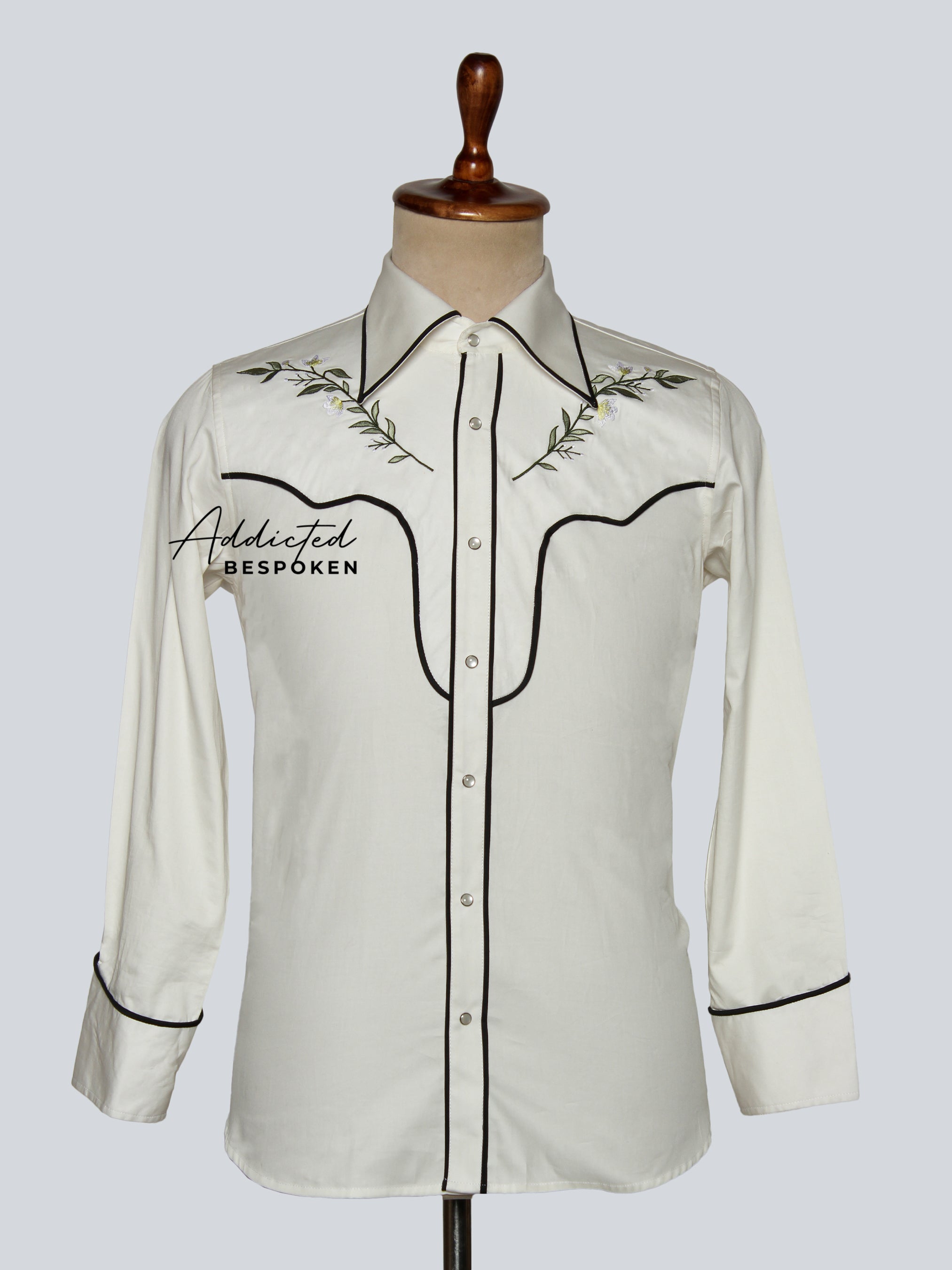 Front view of white western-style long sleeve shirt with black piping and floral embroidery – Addicted Bespoken