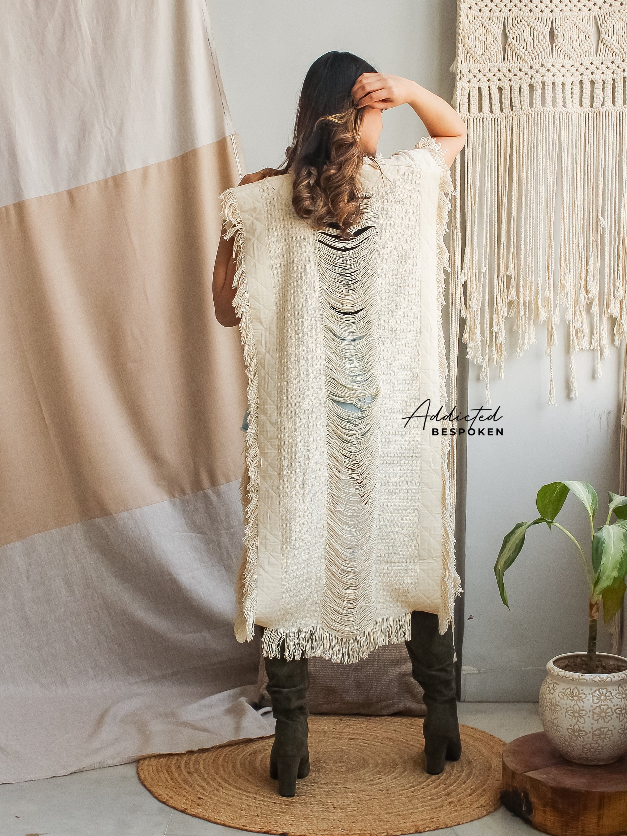 Side view of Boho Chic Belted Poncho – boho clothing outfit with belt and fringe