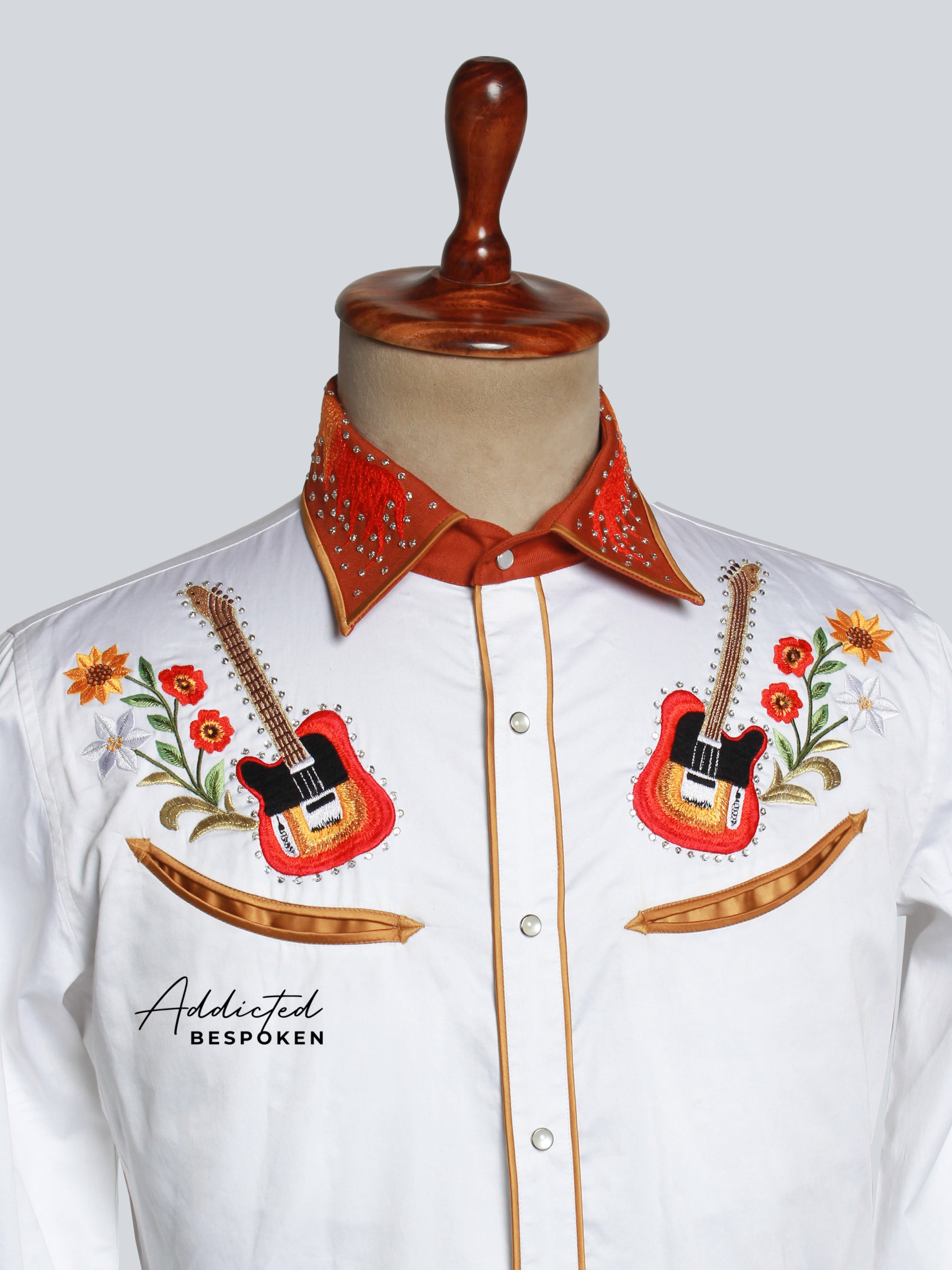 Close-up of embroidered chest and cuffs on white western shirt – Addicted Bespoken