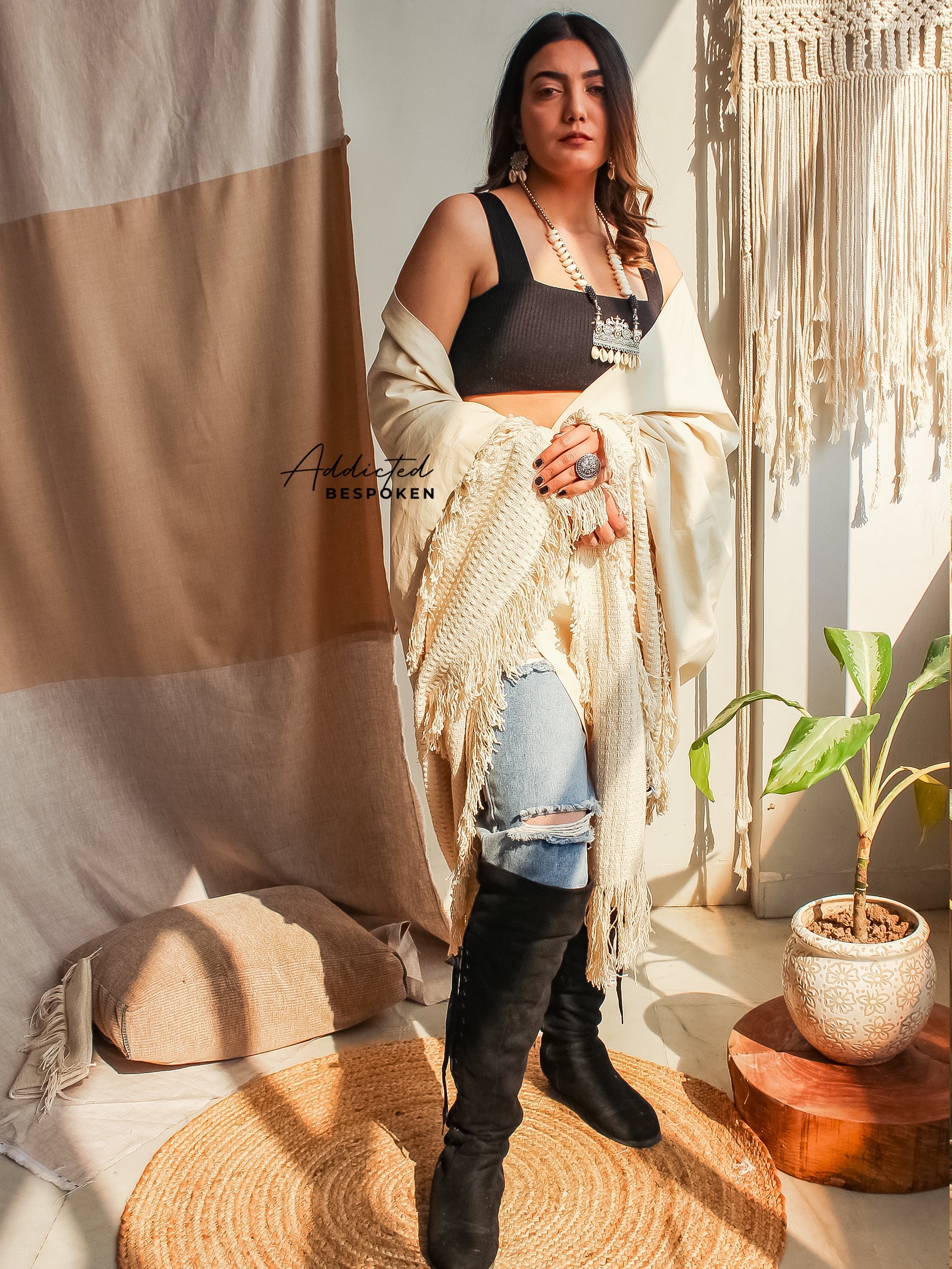 Woman wearing Tribal Boho Fringes Shawl with black crop top and denim – bohemian style clothing
