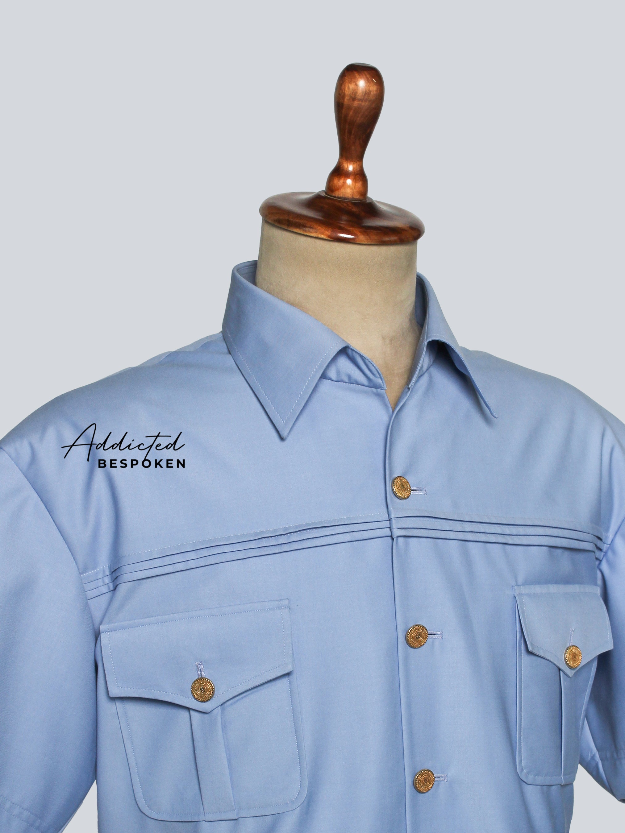 Close-up of chest pocket detail – men’s safari utility shirt with button design