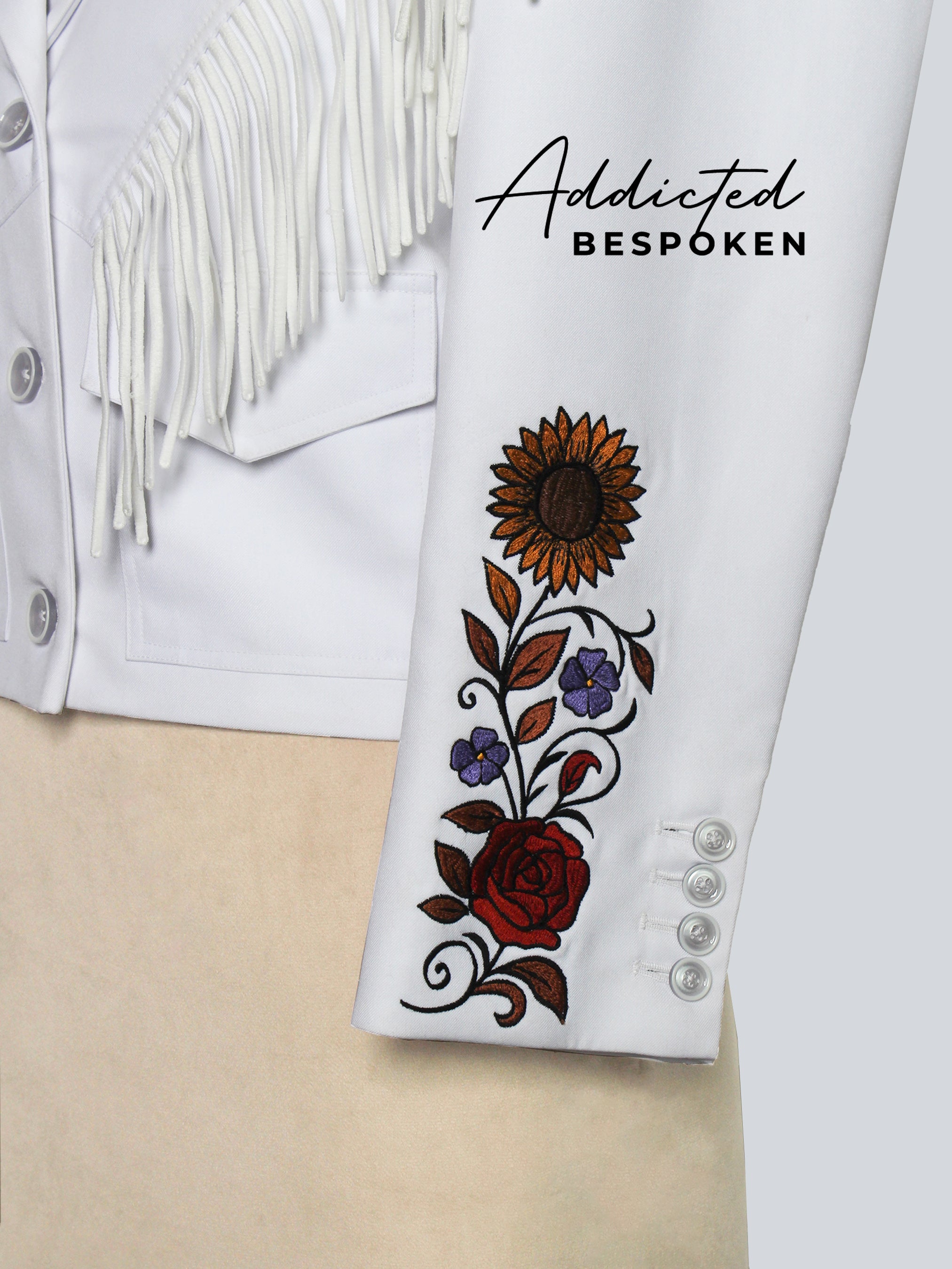 White jacket with floral embroidery and 'Addicted Bespoken' branding.