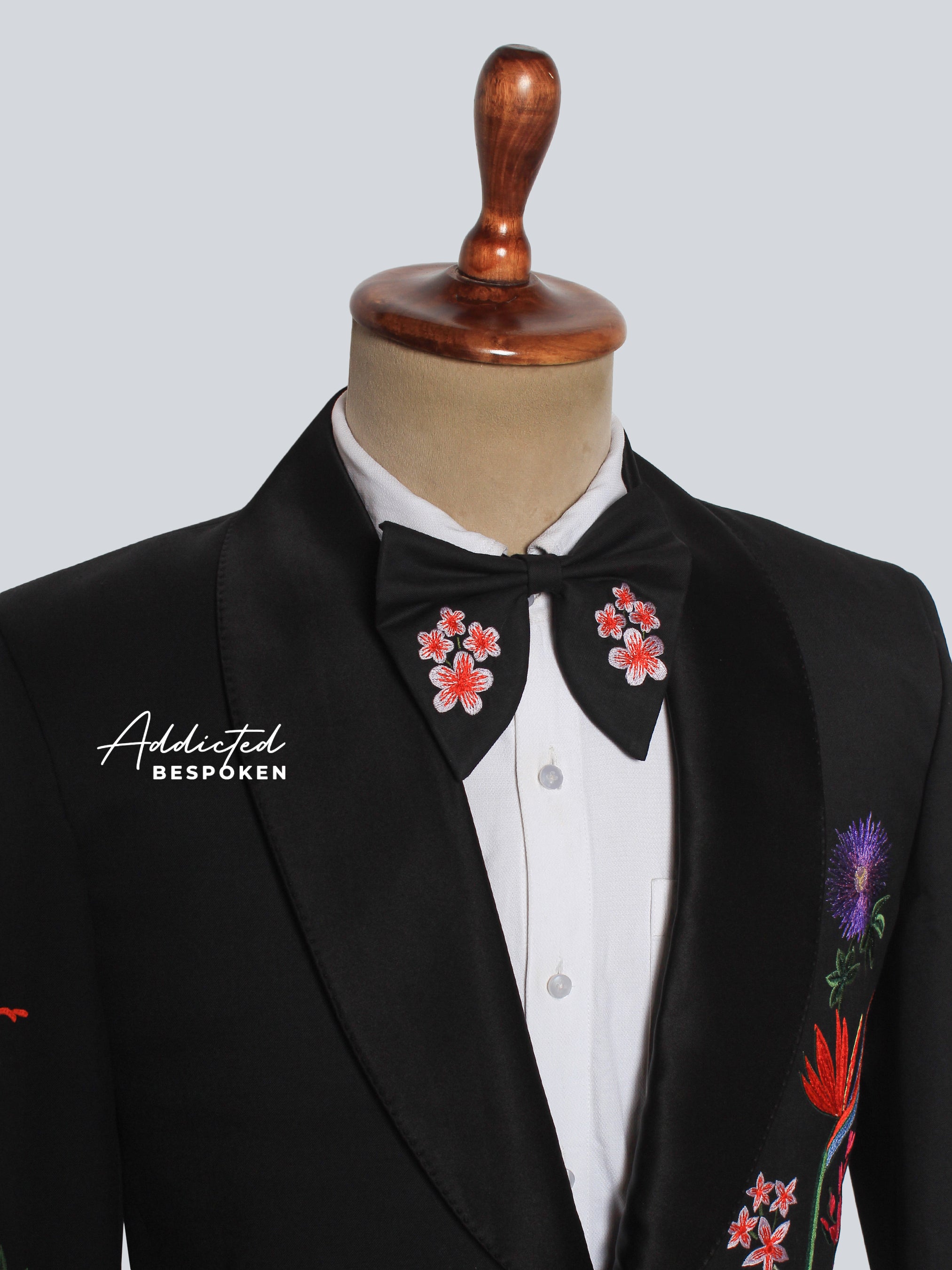 Collar Zoom view of black blazer featuring multicolor floral embroidery on lapel and sleeve