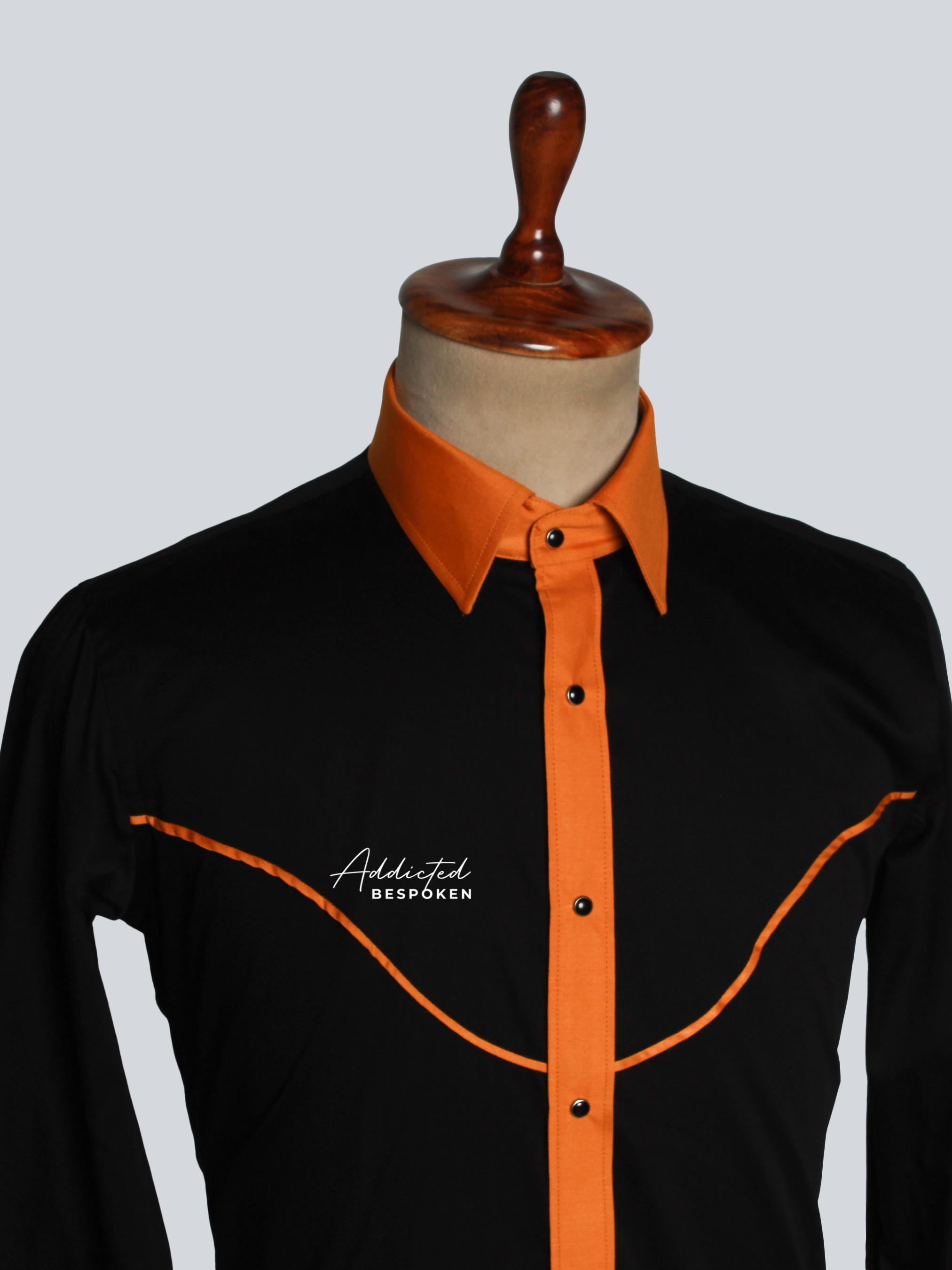 Close-up chest view of black western shirt with orange contrast collar – Addicted Bespoken