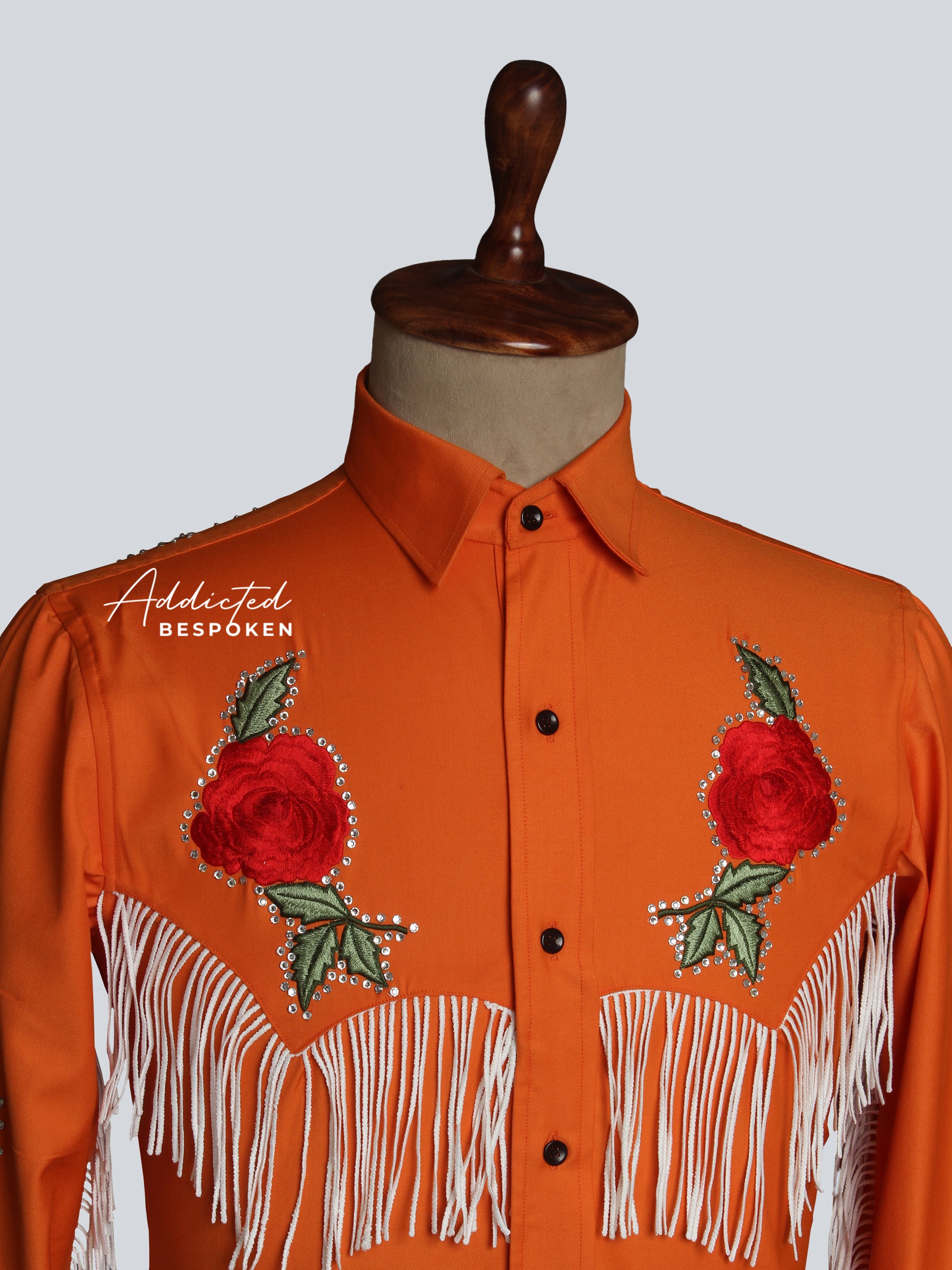 Close-up of embroidered red rose on orange western shirt โ Addicted Bespoken