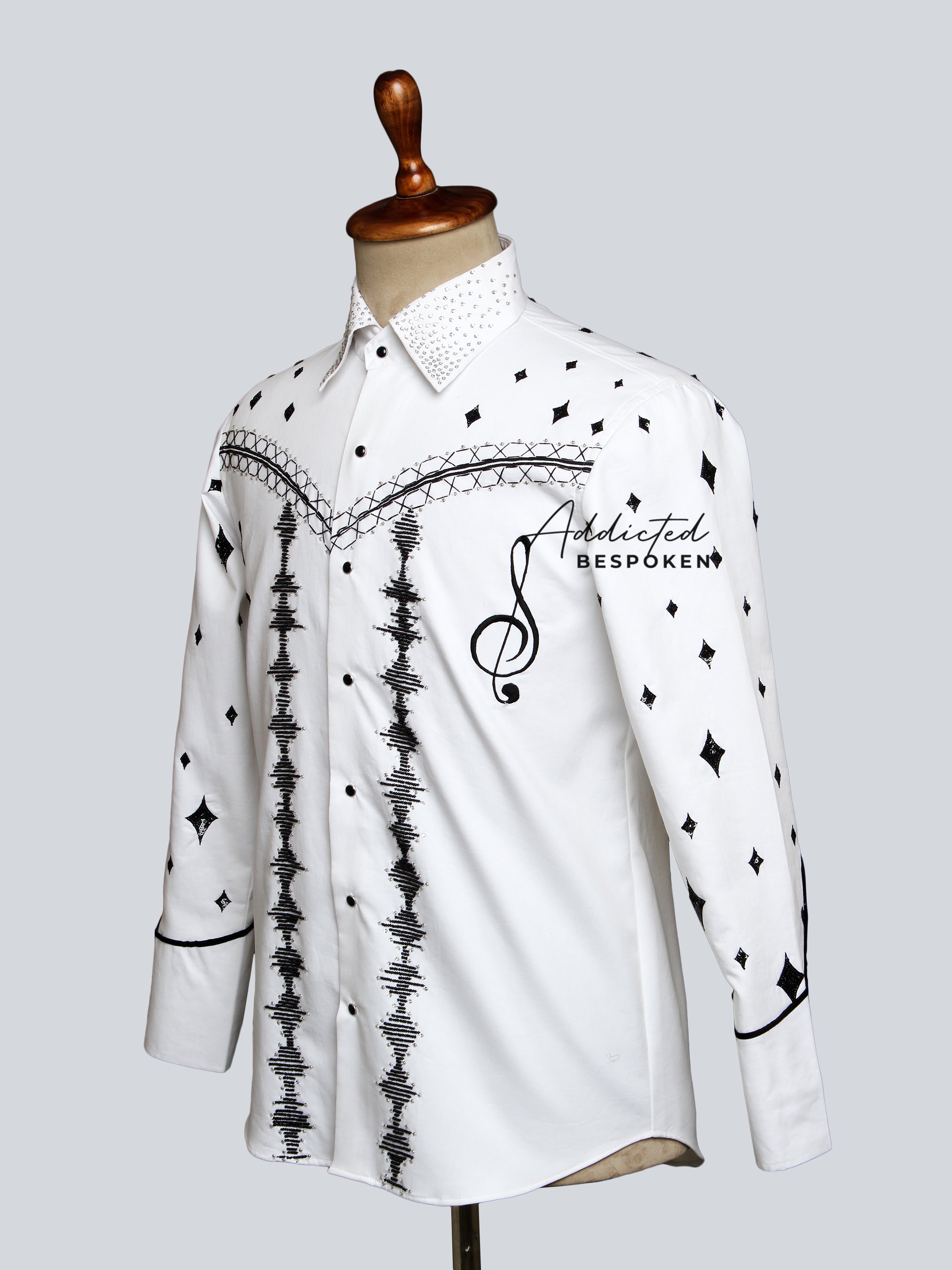 Rear angled mannequin view of white western shirt with black embroidery โ Addicted Bespoken