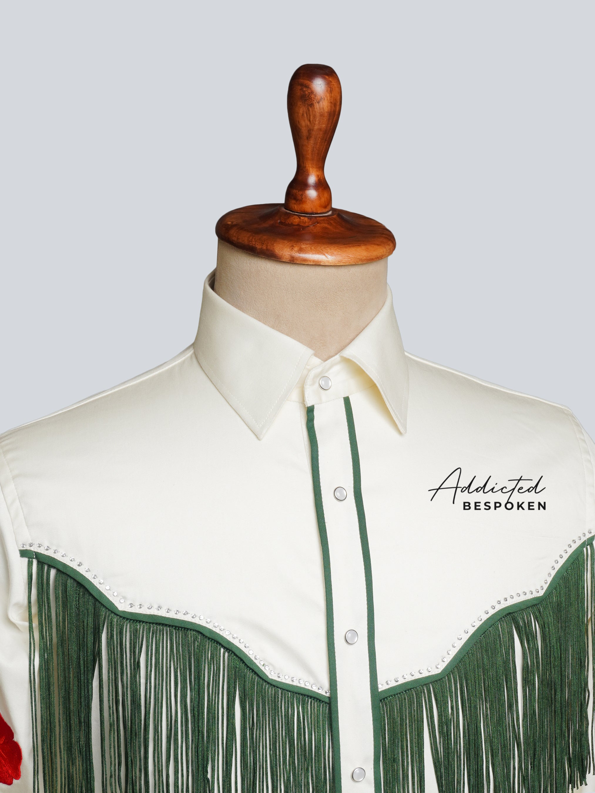 Close-up chest view of white embroidered western shirt with green fringe โ Addicted Bespoken