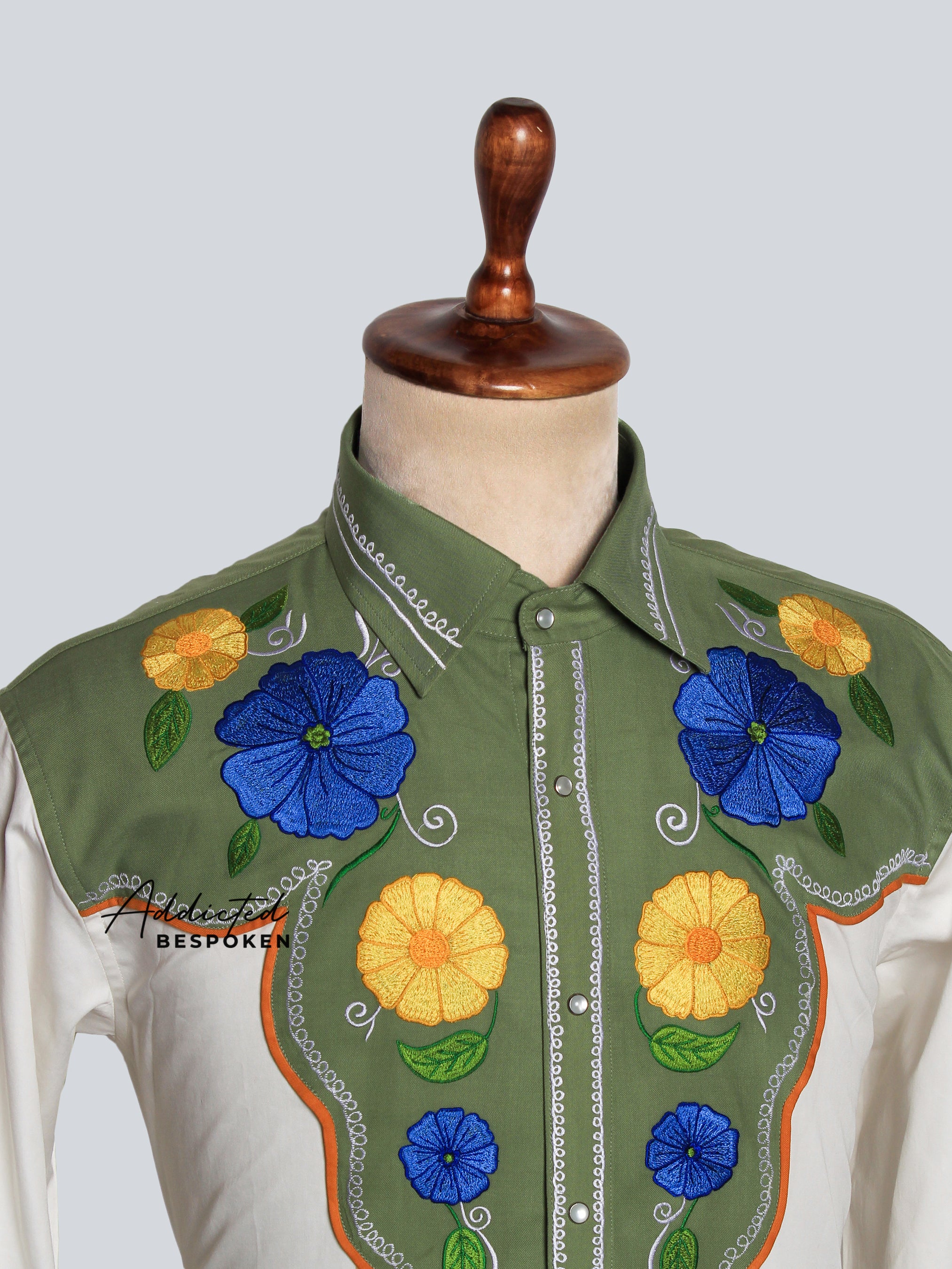 Close-up of colorful floral embroidery on chest and yoke of white western shirt – Addicted Bespoken