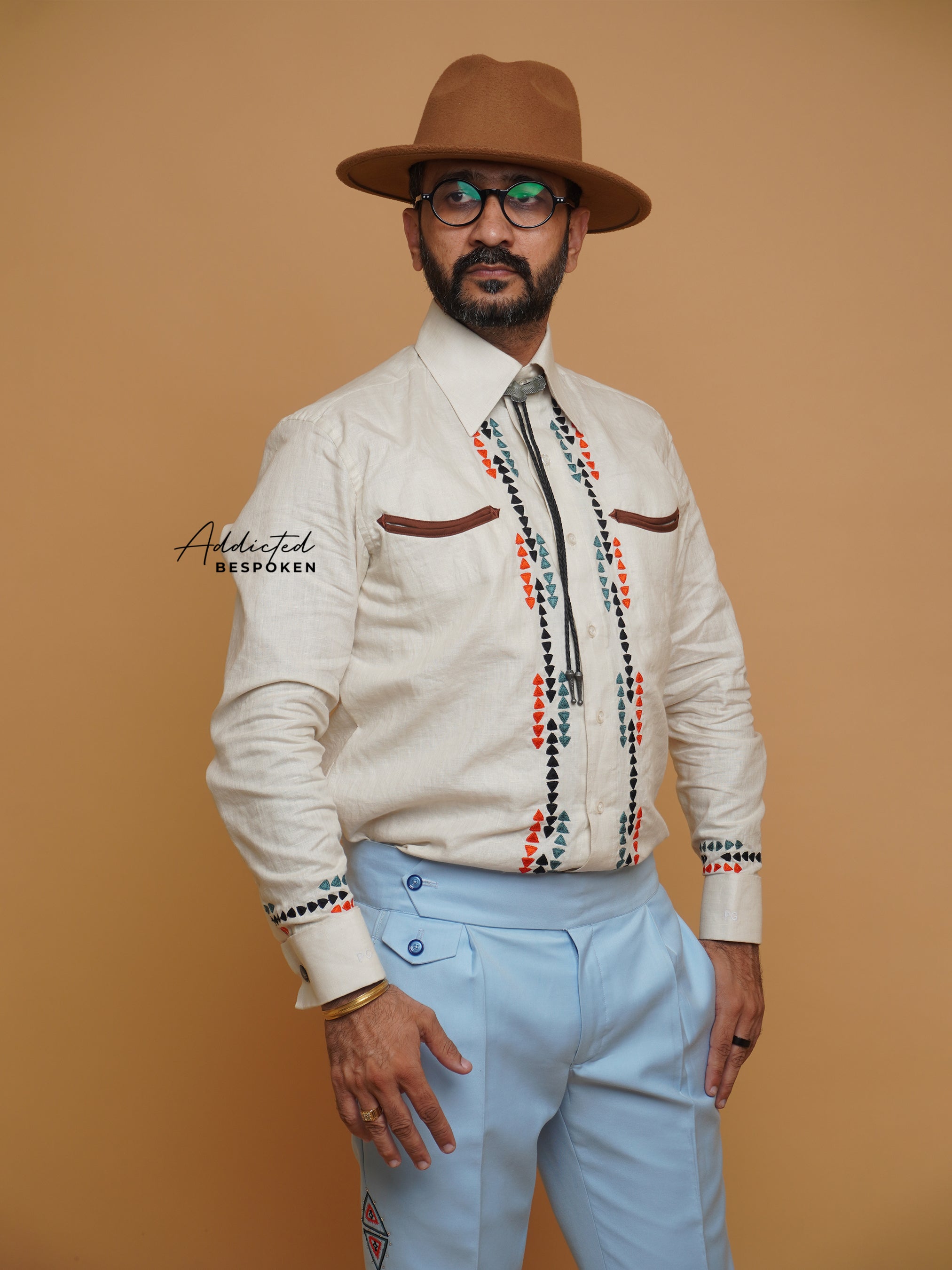 Angled front view of male model in cream western shirt with embroidery β Addicted Bespoken