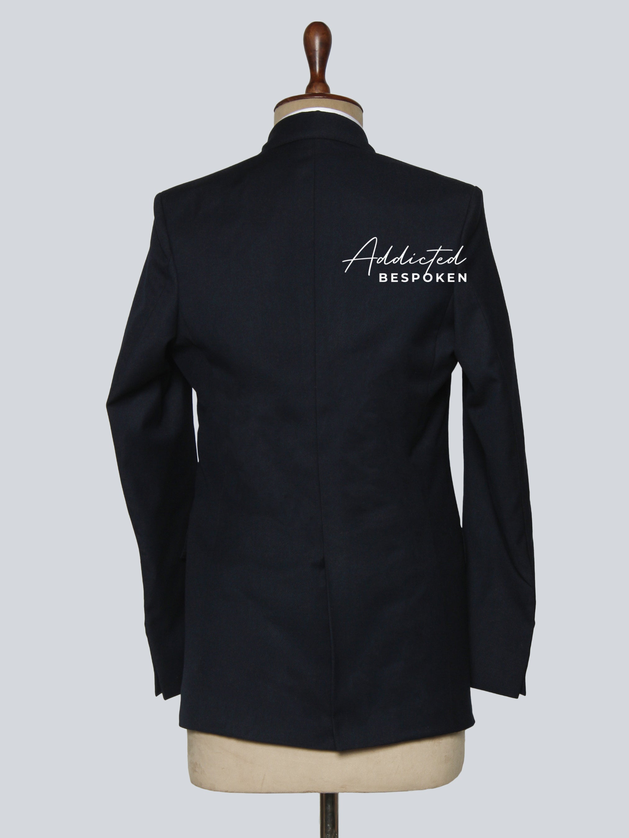 Signature classic formal suit back view – tailored black two-piece suit with structured shoulders
