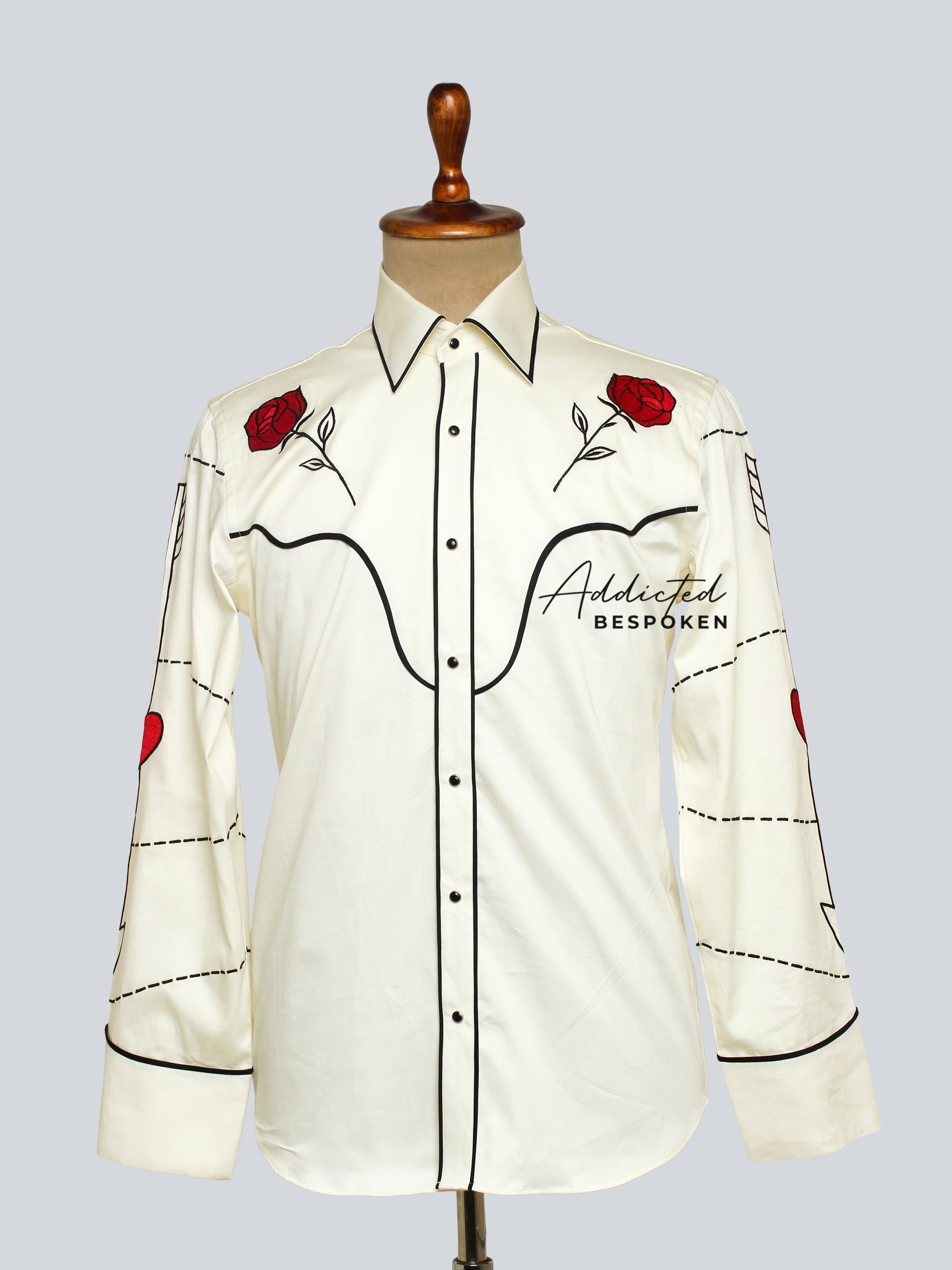 Front view of cream western shirt with black piping and red floral embroidery on shoulders – Addicted Bespoken