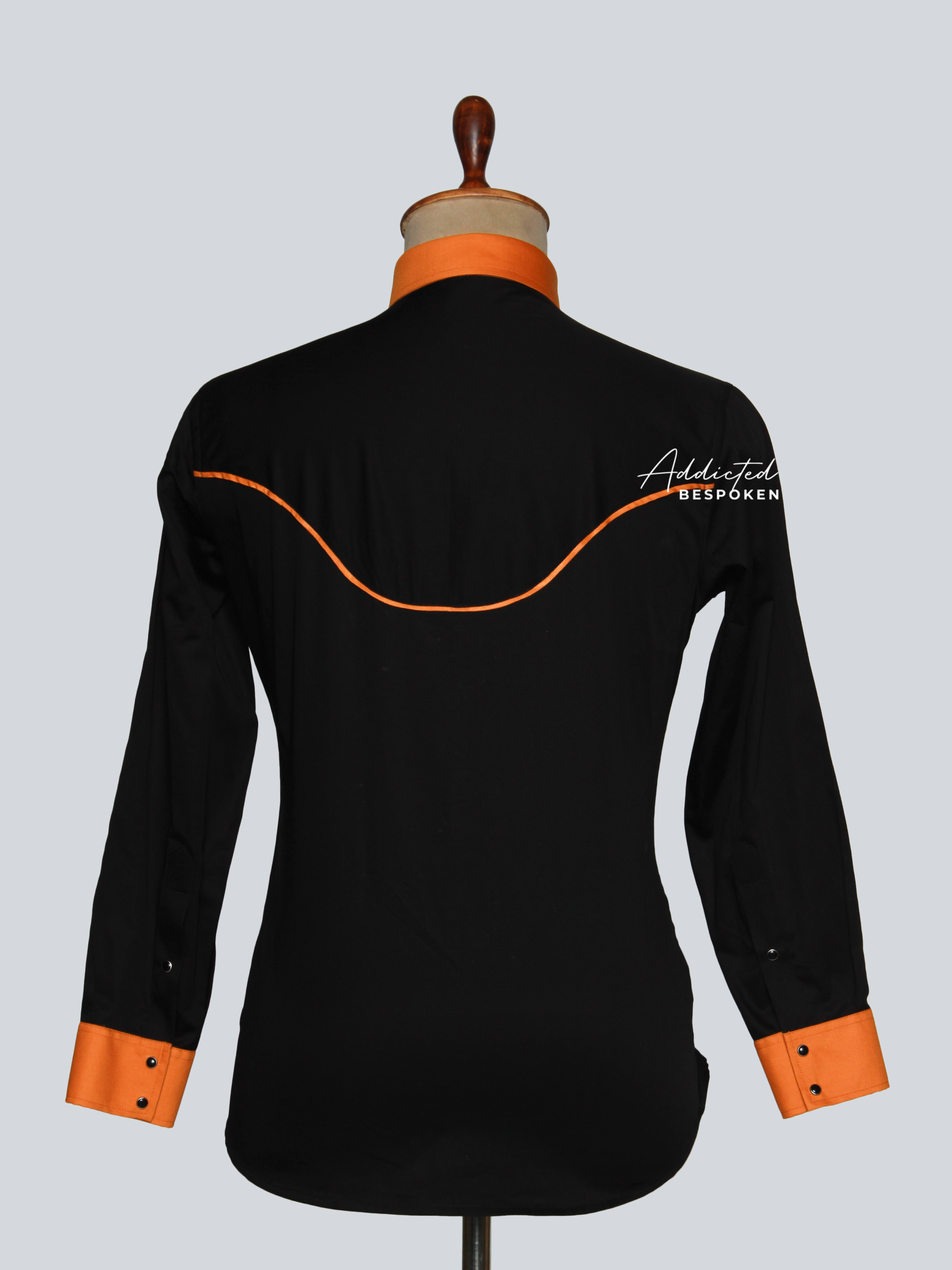 Back view of black western shirt with orange contrast details โ Addicted Bespoken