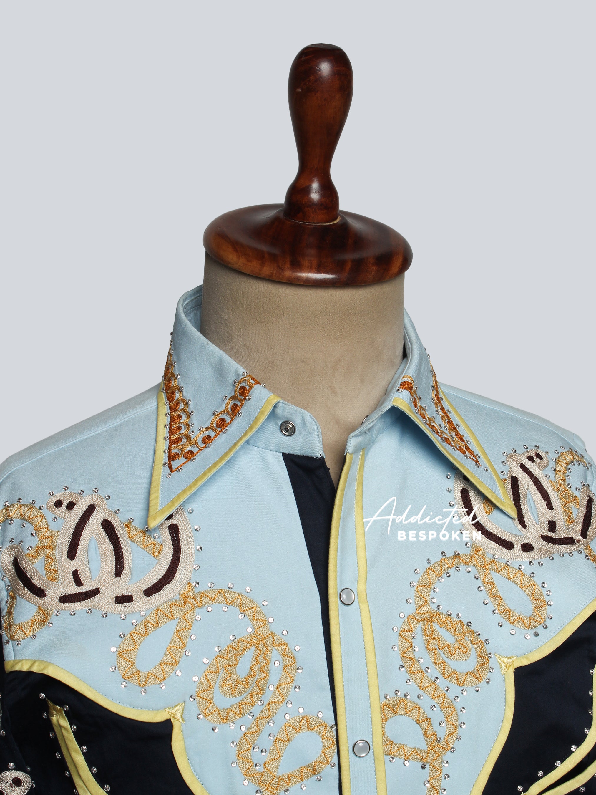 Close-up of golden embroidery detail on collar of western shirt – Addicted Bespoken