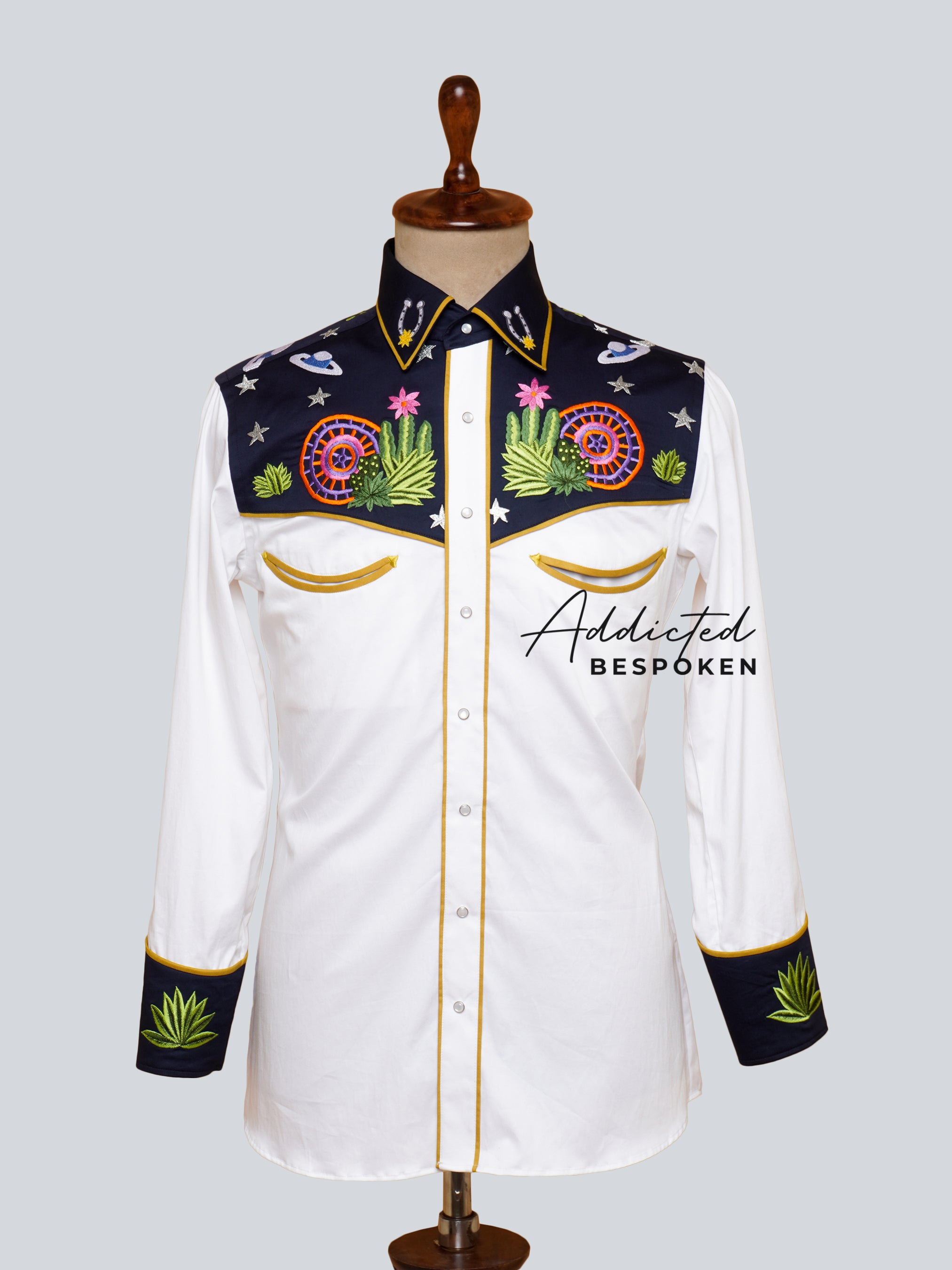 Front view of white western shirt with black yoke and colorful floral embroidery – Addicted Bespoken
