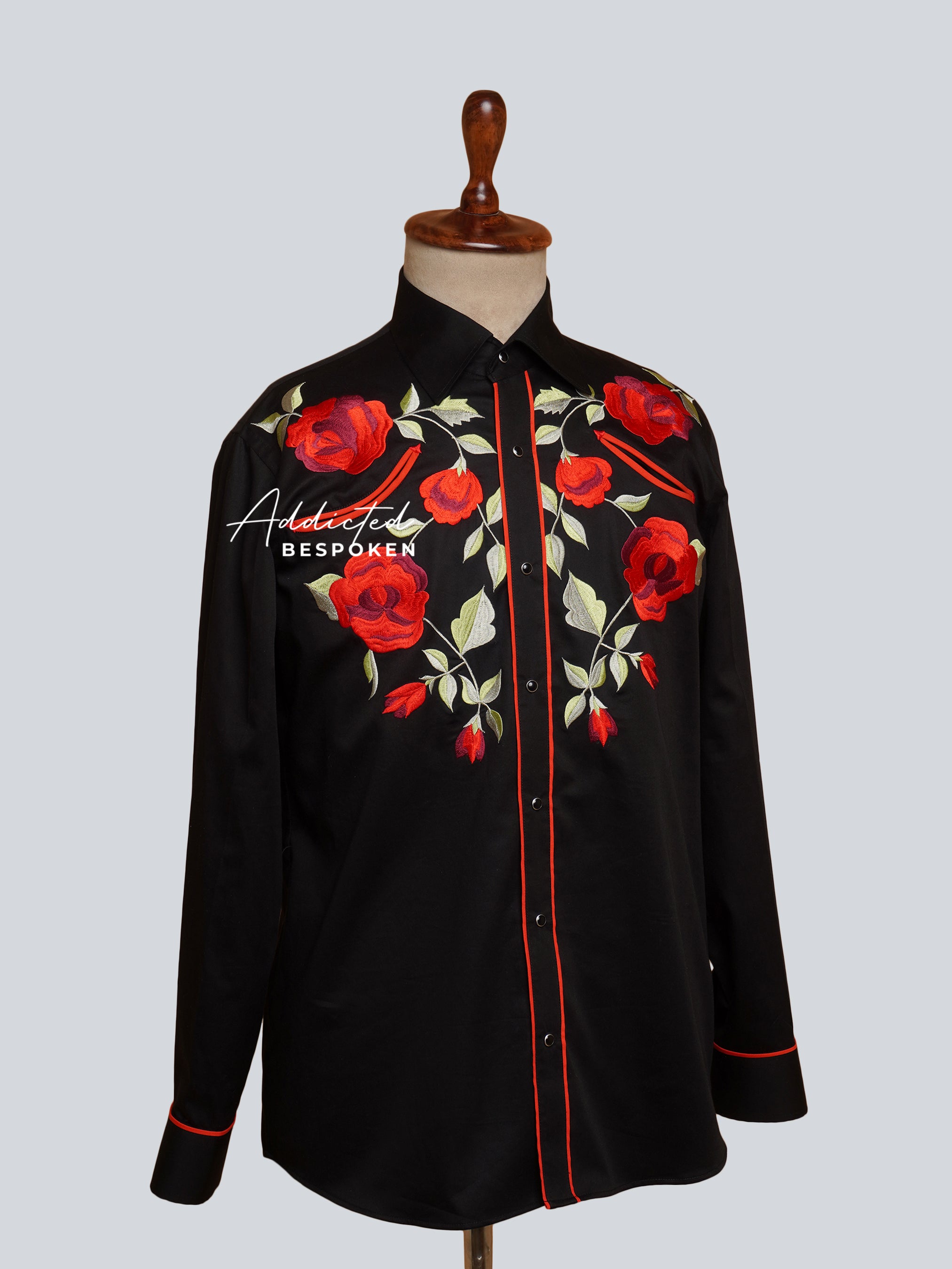 Angled side view of black western shirt with red embroidered flowers β Addicted Bespoken