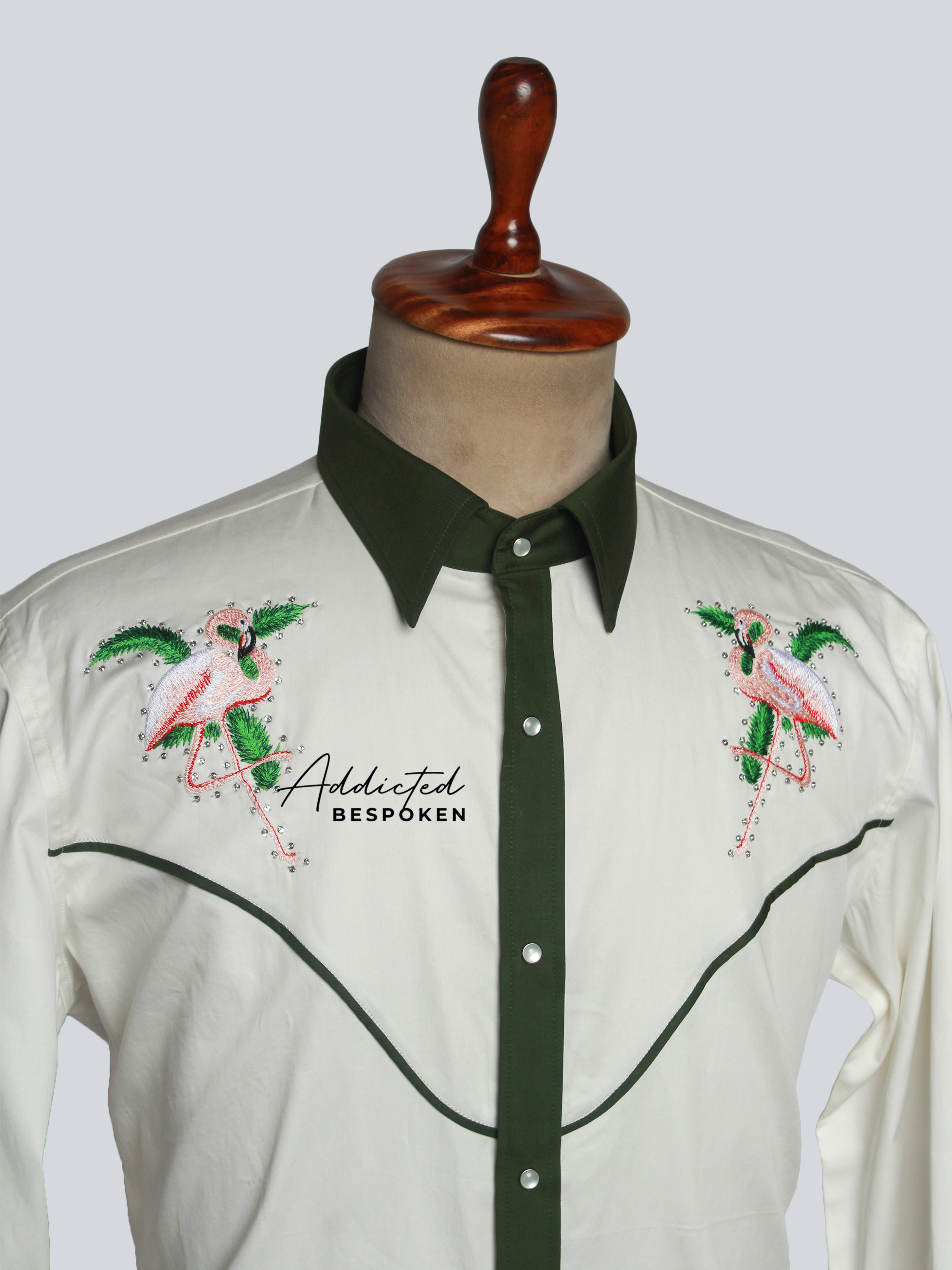 Close-up angled chest view of white shirt with green piping and floral embroidery โ Addicted Bespoken