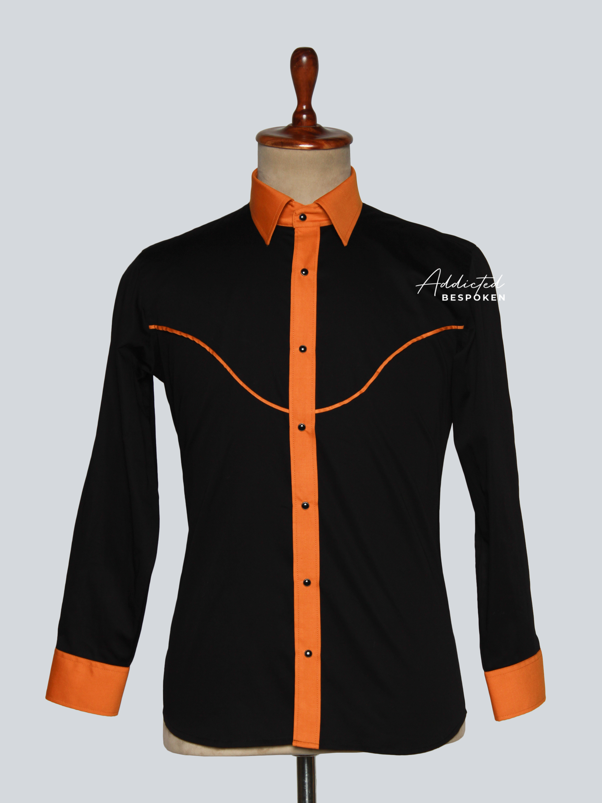 Front view of black western shirt with orange collar, cuffs, and piping โ Addicted Bespoken