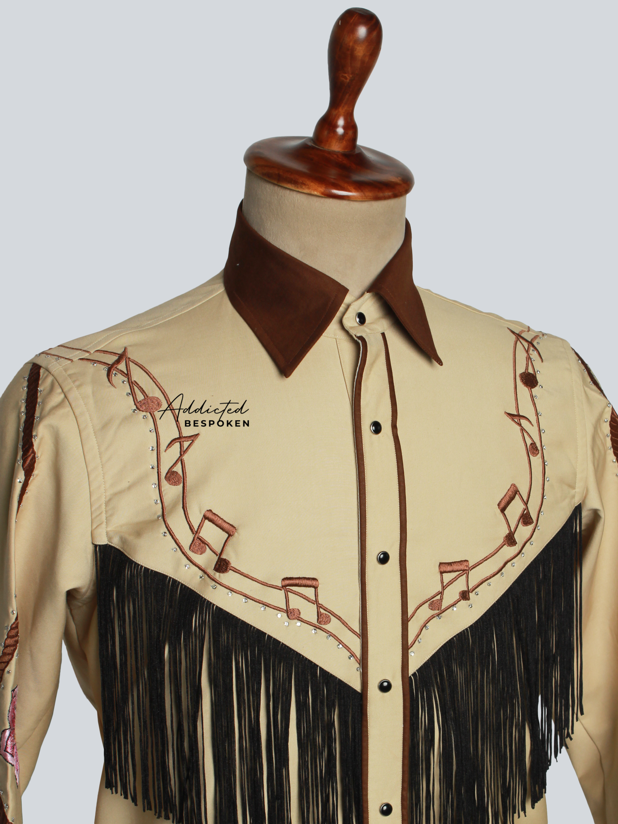 Close-up chest view of tan western shirt with fringe and embroidery details – Addicted Bespoken