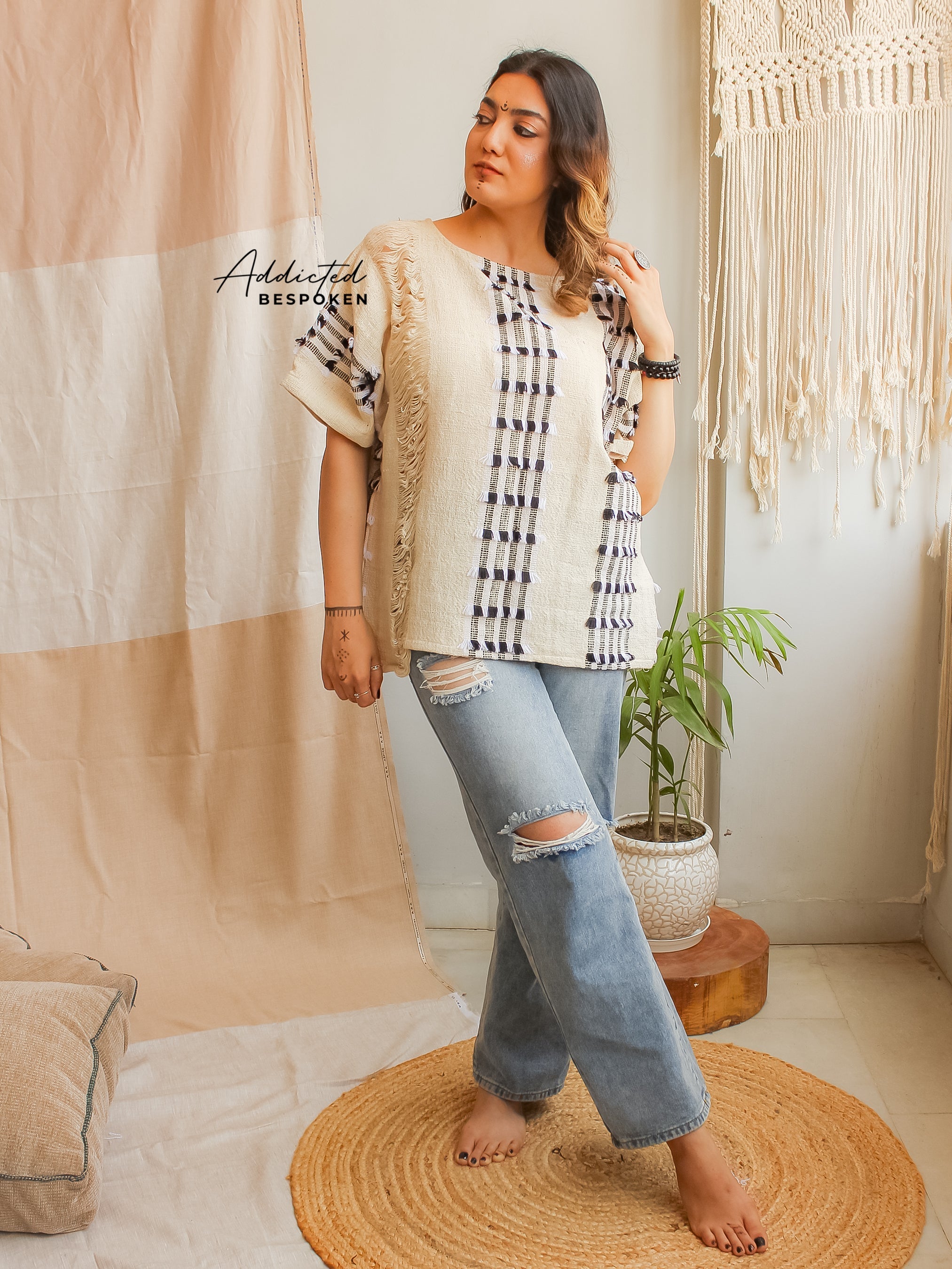 Side view of Free Spirit Nomad Top styled with jeans – casual boho clothing look