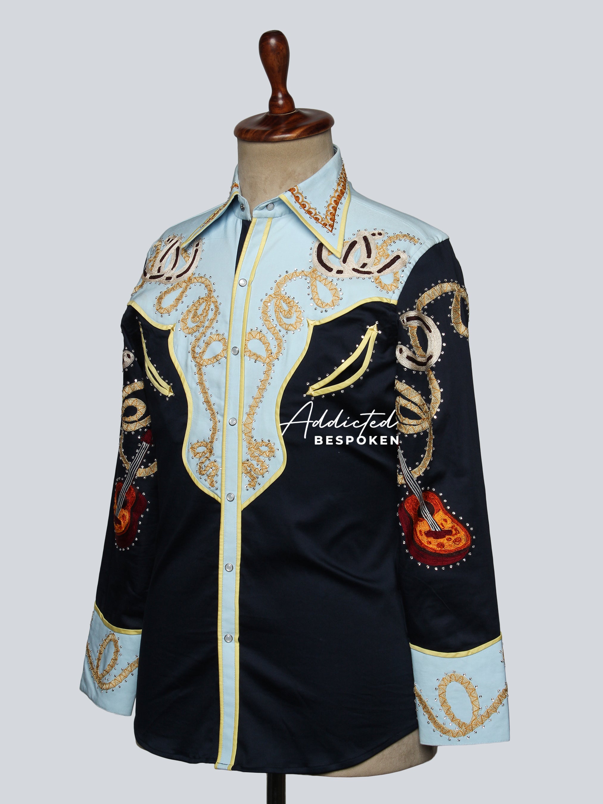 Side view of embroidered western shirt with golden motifs on mannequin – Addicted Bespoken