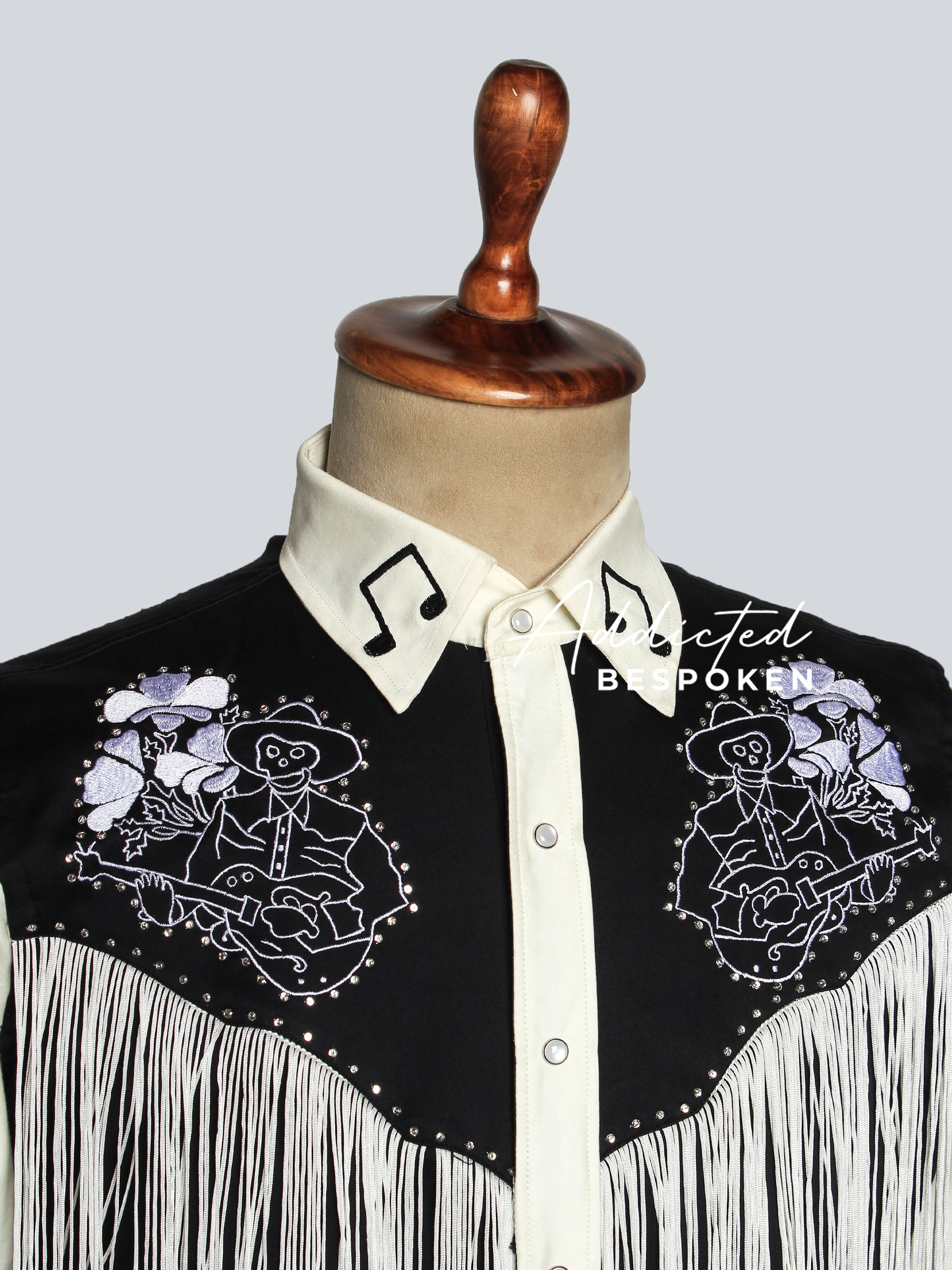 Close-up of embroidered floral design on black and white western shirt – Addicted Bespoken