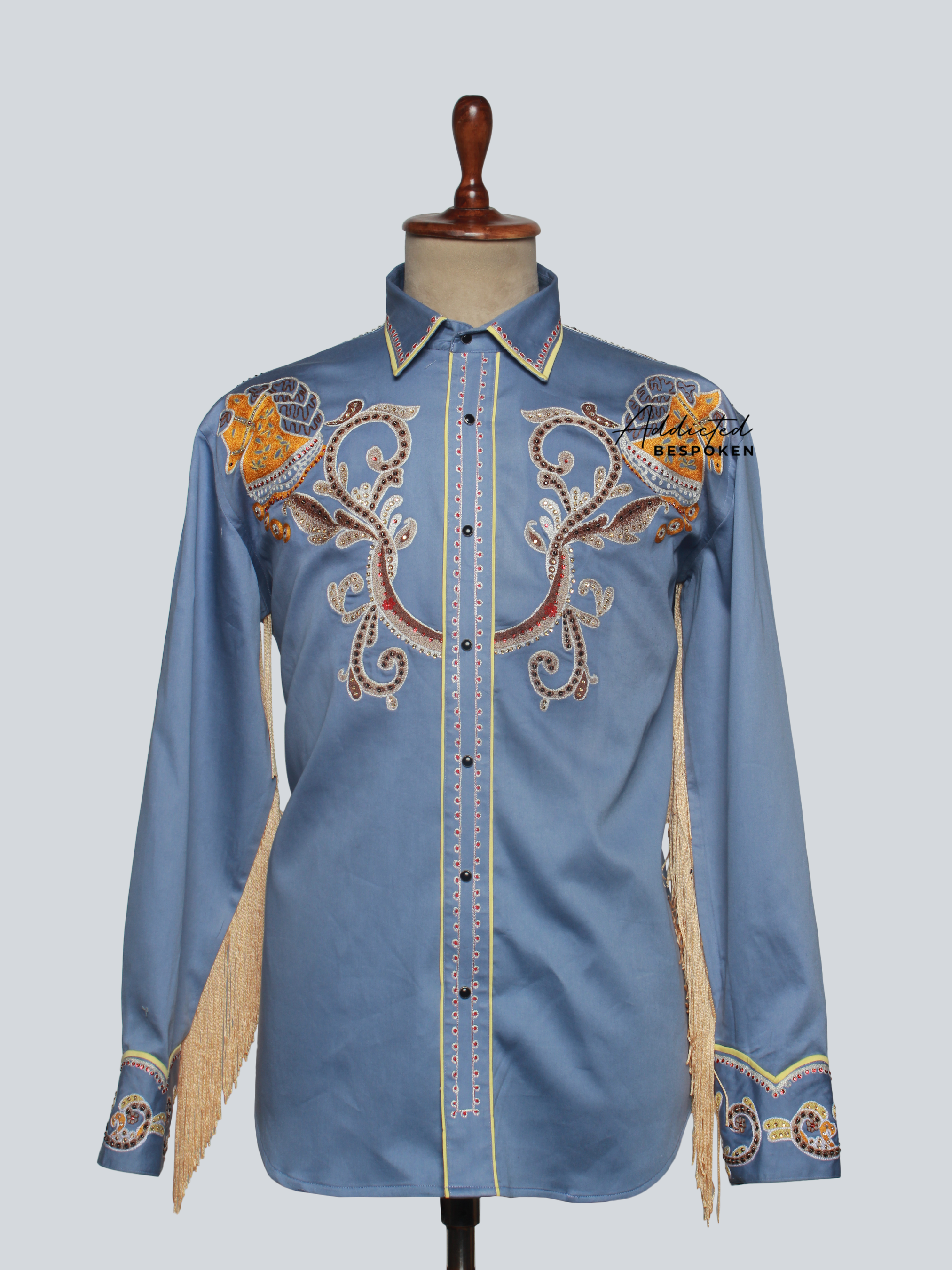 Front view of light blue western shirt with golden floral embroidery and detailed cuffs – Addicted Bespoken