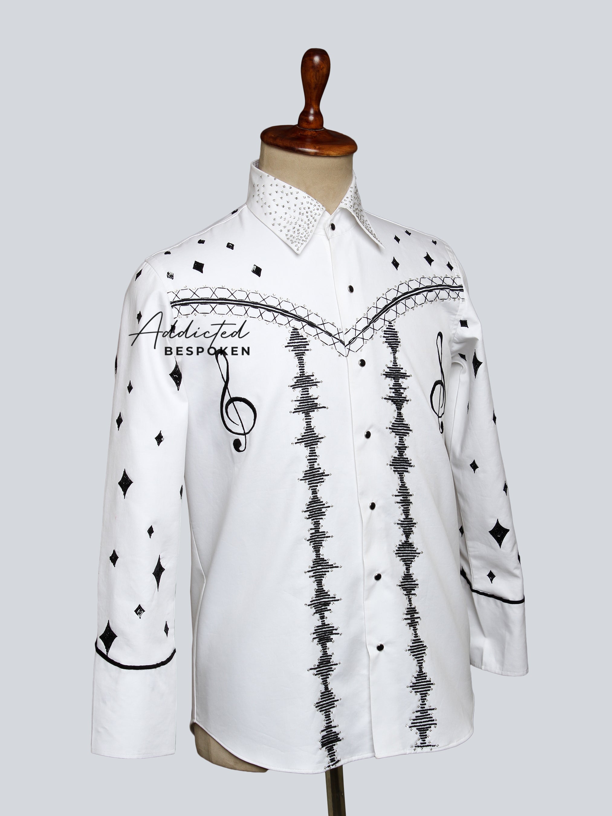 Angled side view of white embroidered western shirt with black detailing โ Addicted Bespoken