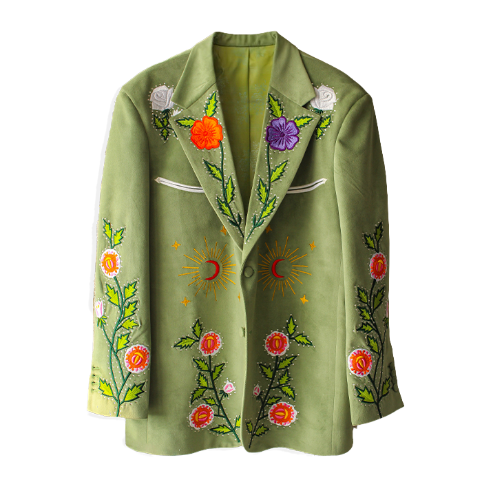 Green bespoke blazer from Addicted Bespoken featuring vibrant floral embroidery with suns and moons motif on a transparent background
