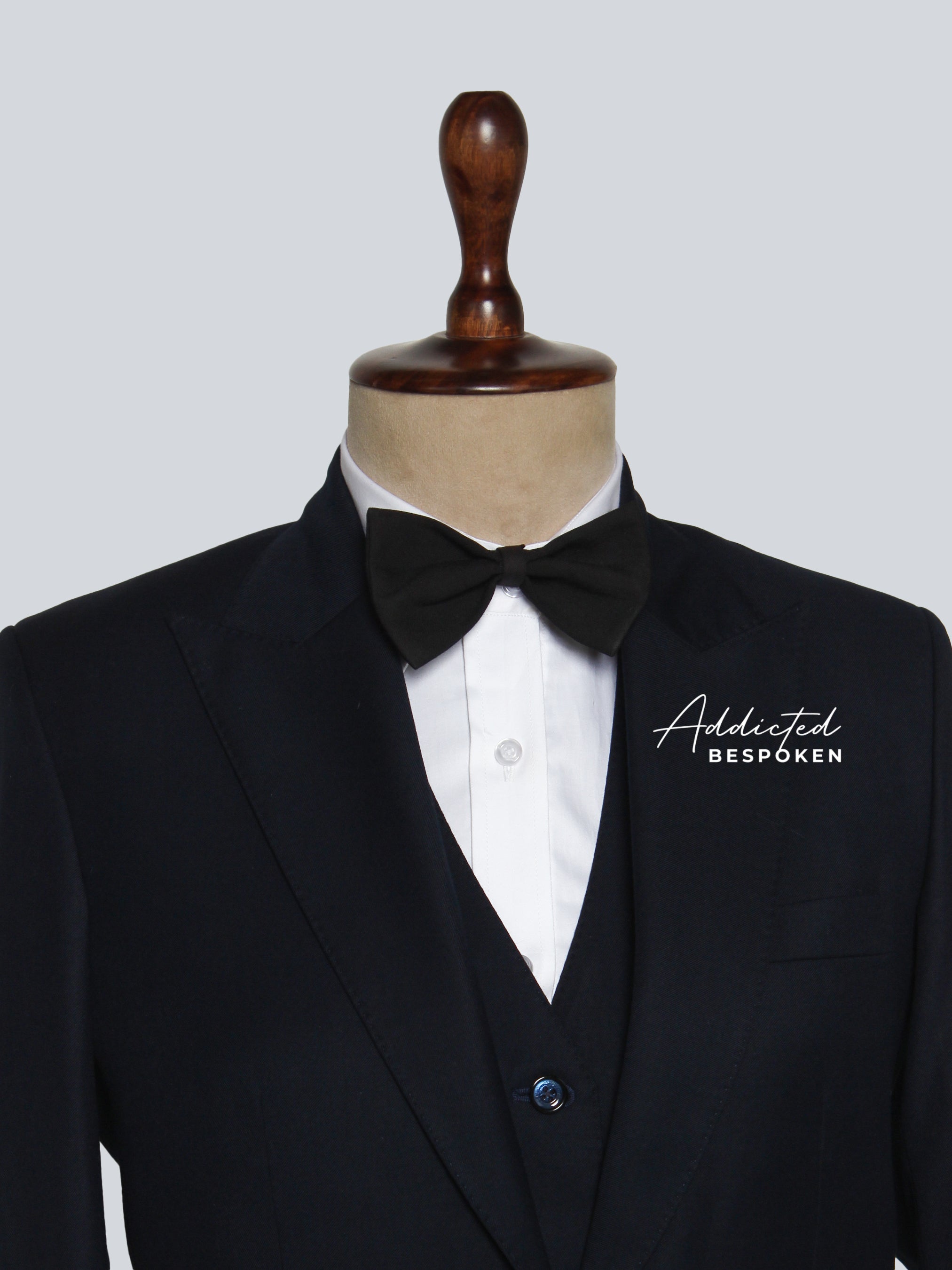 Signature classic formal suit lapel close-up โ tailored notch lapel design in black fabric
