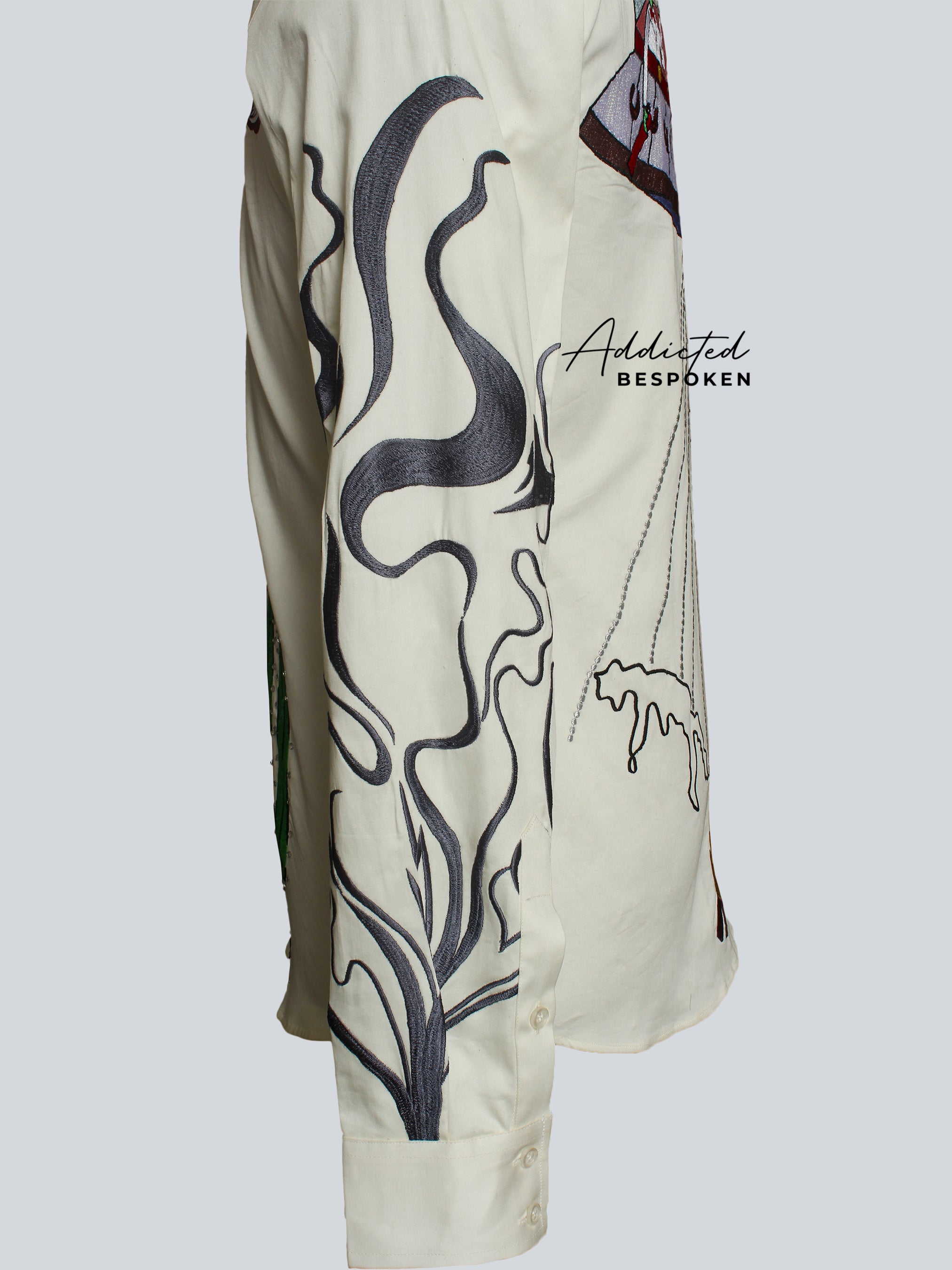 Close-up of bird embroidery motif on cream western shirt โ Addicted Bespoken