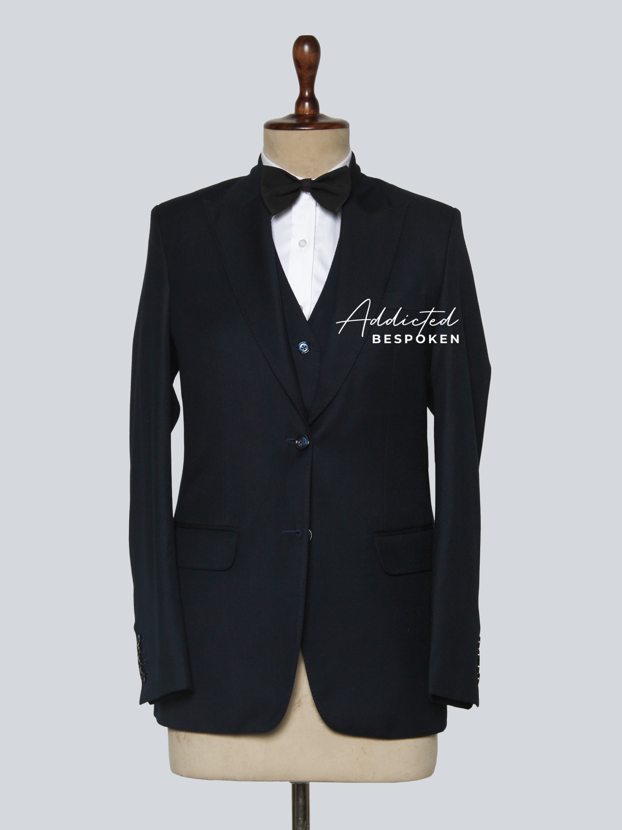 Signature classic formal suit front view – men’s tailored black jacket with notch lapel and matching trousers