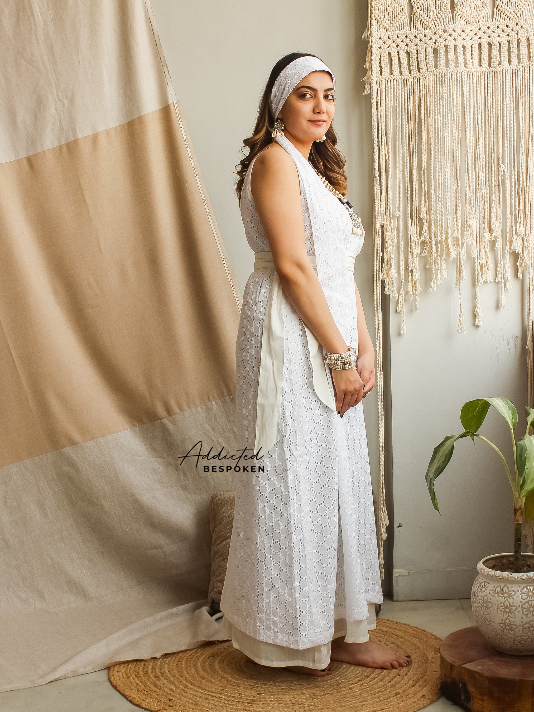 Side profile of woman in White Eyelet V-Gown – relaxed fit boho dress