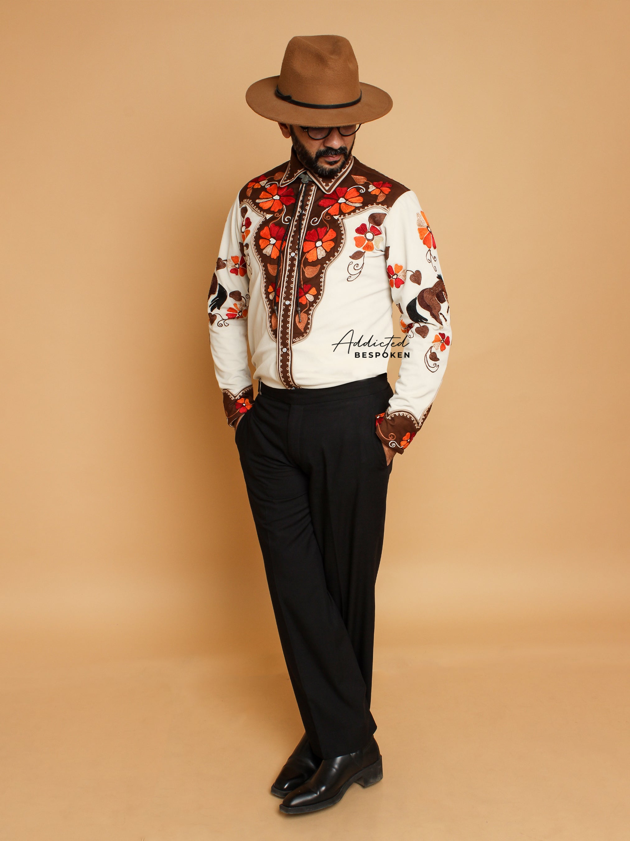 Side standing view of male model in cream western shirt with floral embroidery โ Addicted Bespoken