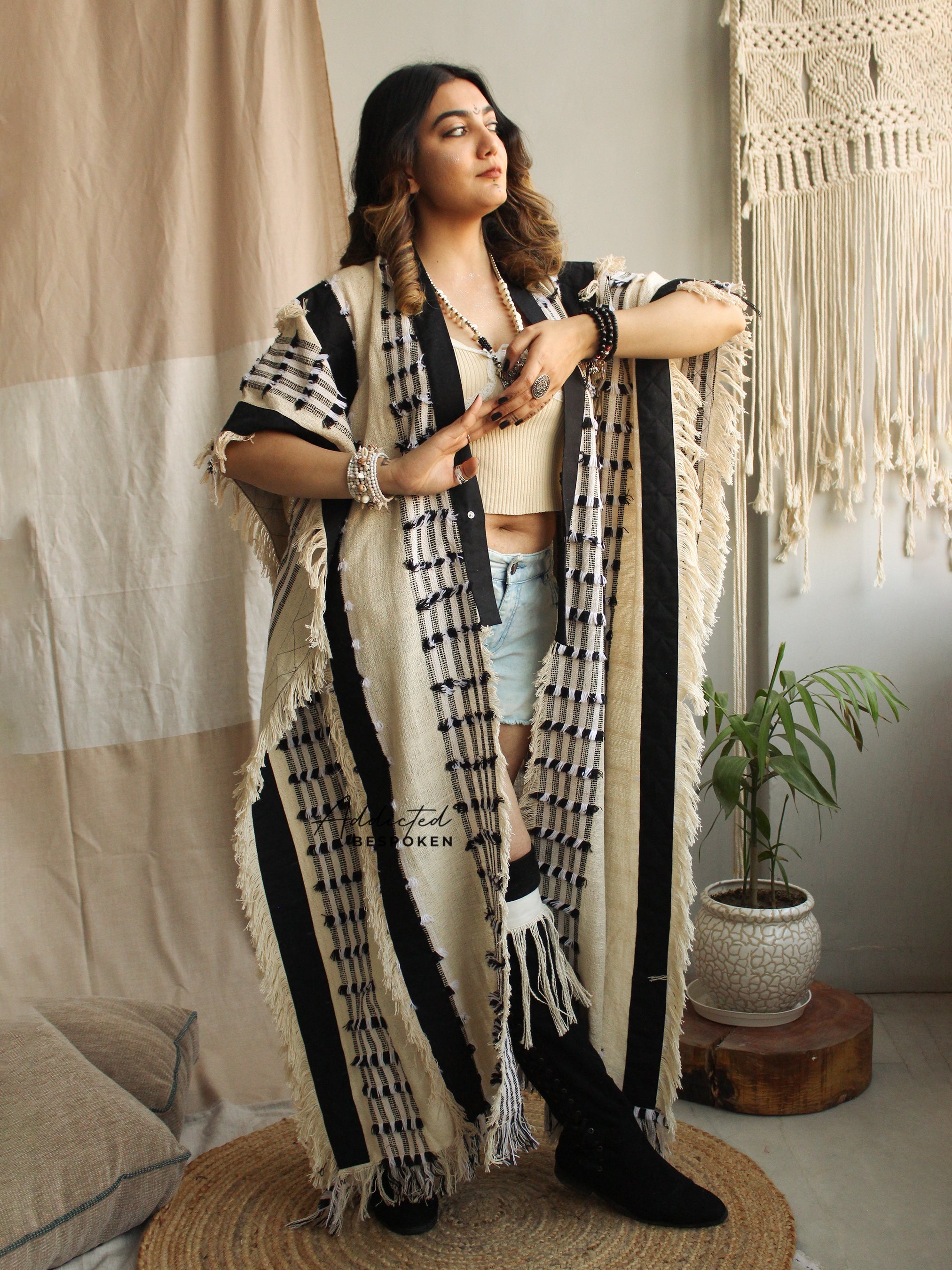 Woman posing in Nomadic Boho Cardigan Coat with tribal stripes – oversized bohemian style clothing