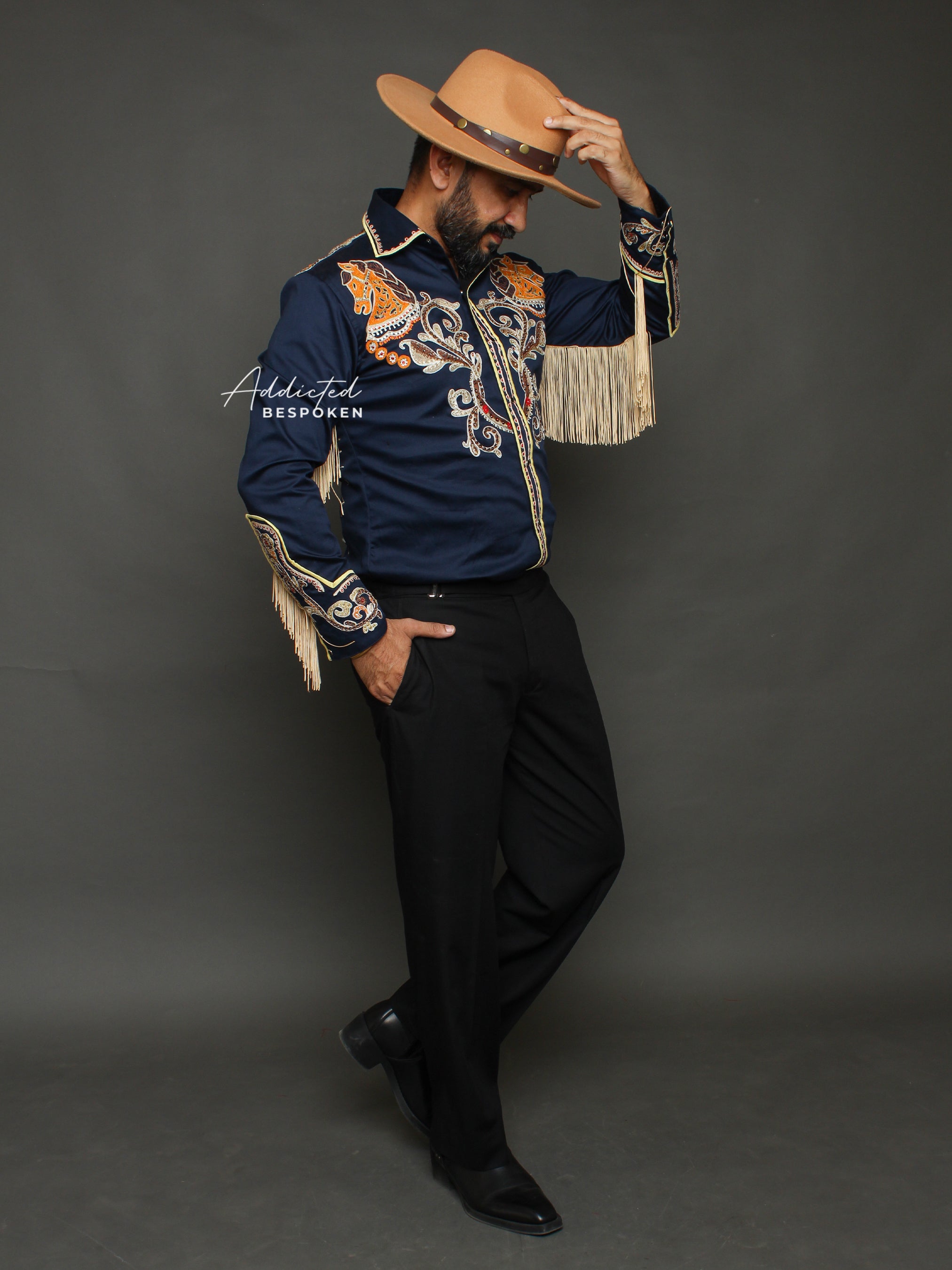 Side angled view of male model wearing navy blue western shirt with golden embroidery β Addicted Bespoken
