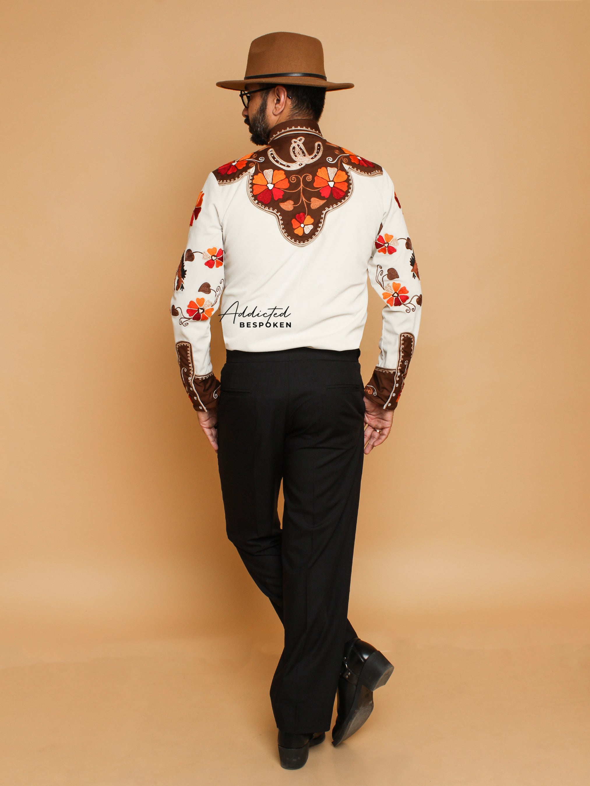 Back view of male model in cream embroidered western shirt with floral motifs – Addicted Bespoken